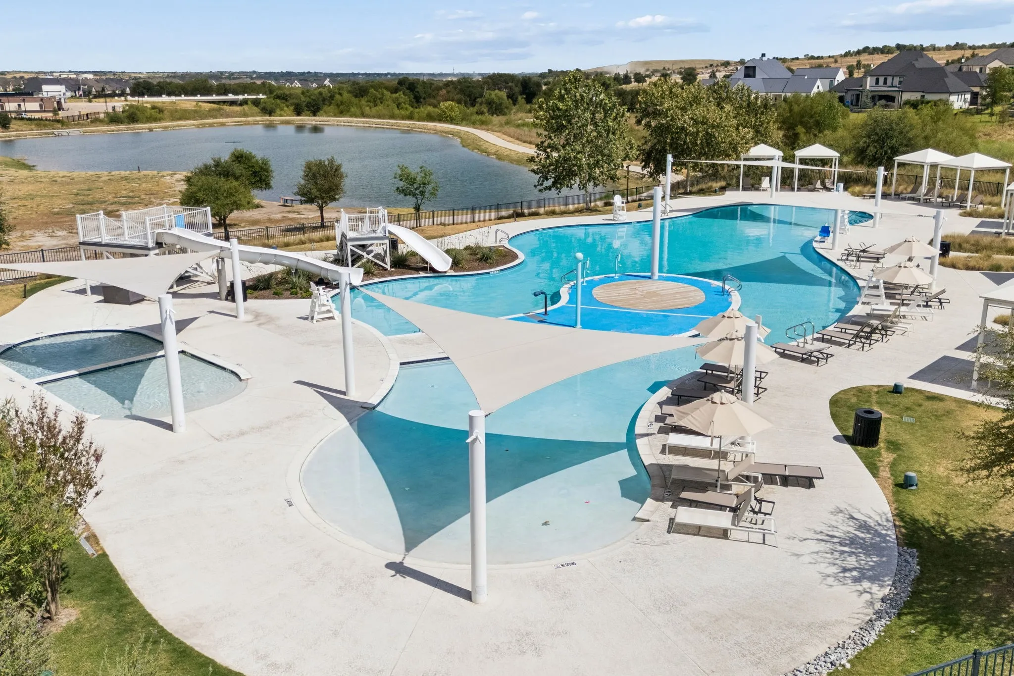 Overlooking the lake is one of three community pools.