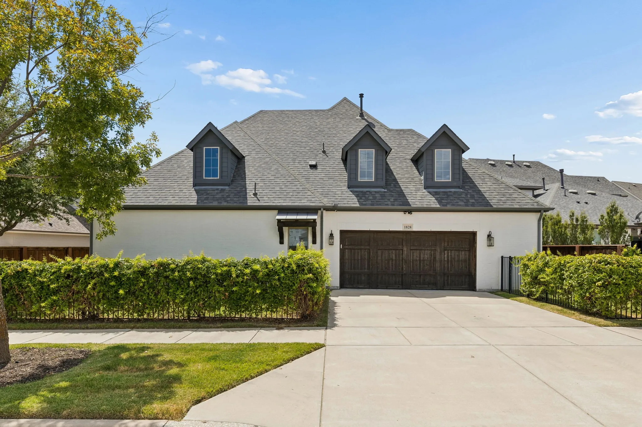 View from the back of the home featuring an oversized two-car garage.