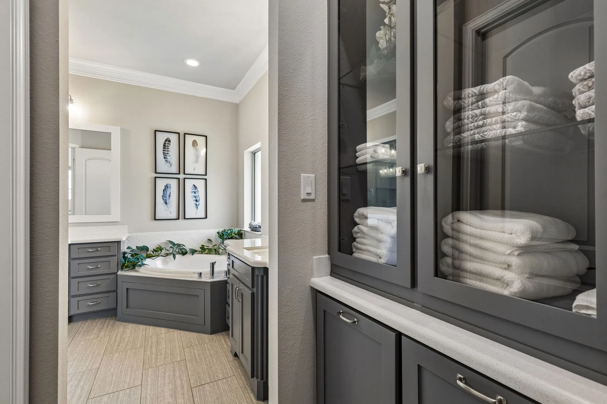 Linen closet between primary bathroom and walk in closet.