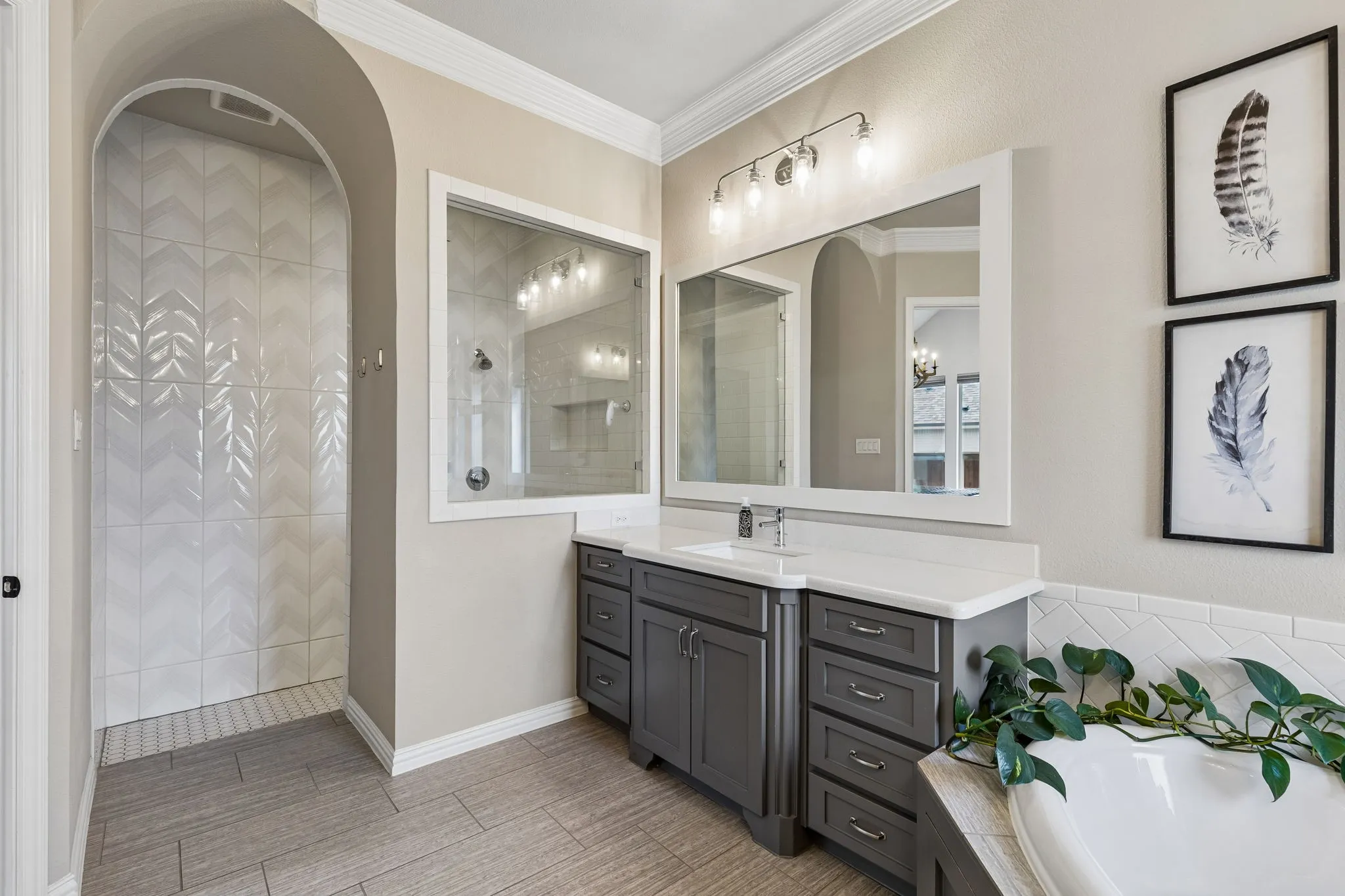Primary bathroom featuring large walk in shower.