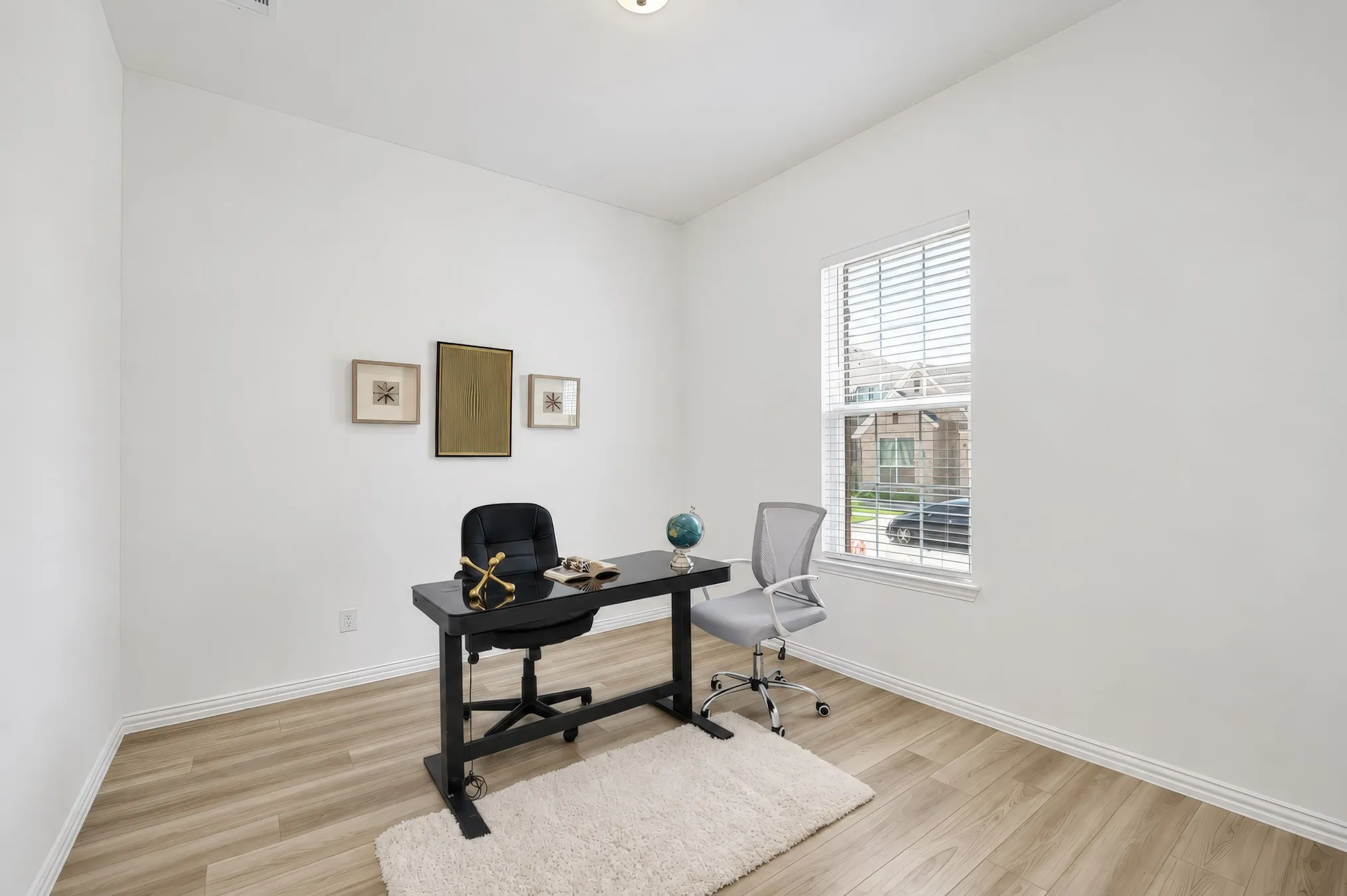 Recessed lighting, wood-finish flooring, and a single window with horizontal blinds