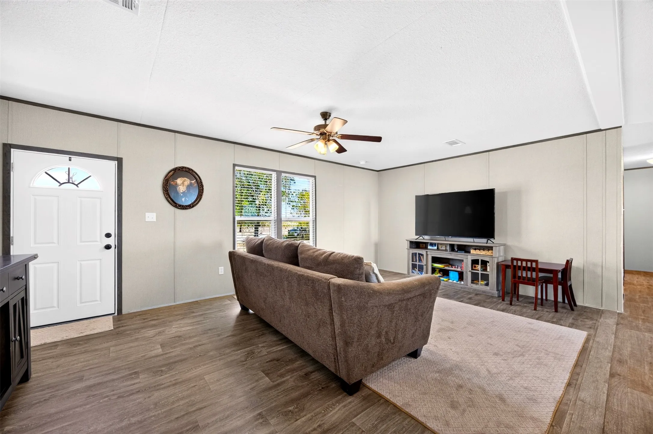 Wood-finish flooring throughout the living area
