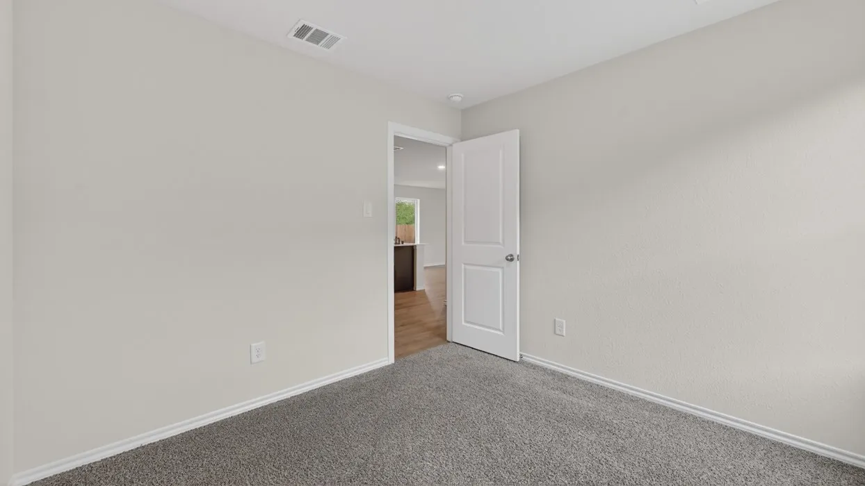 Neutral wall color, wall-to-wall carpeting, white interior door, recessed lighting
