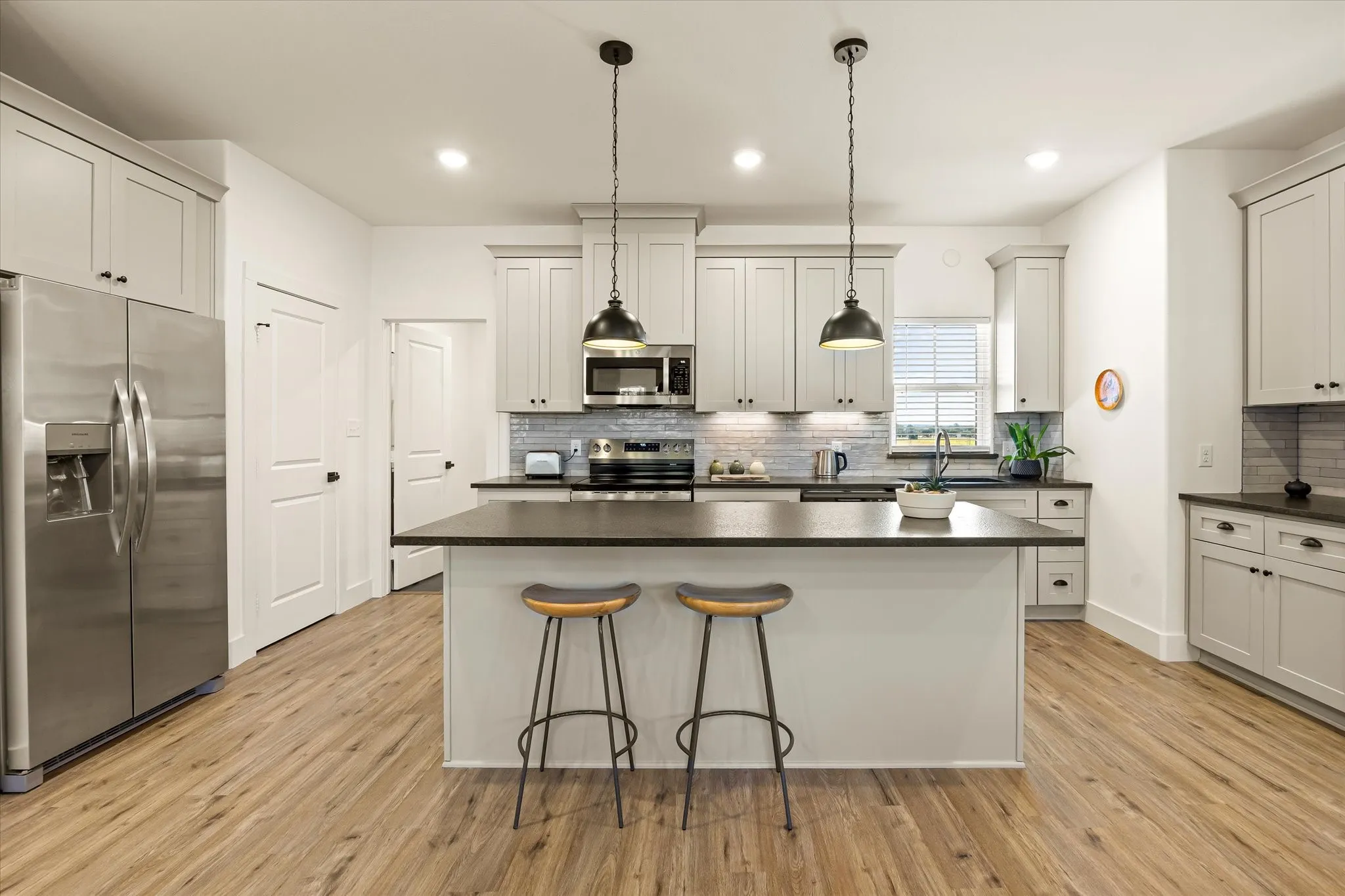 Eat-in kitchen with pantry and large island.
