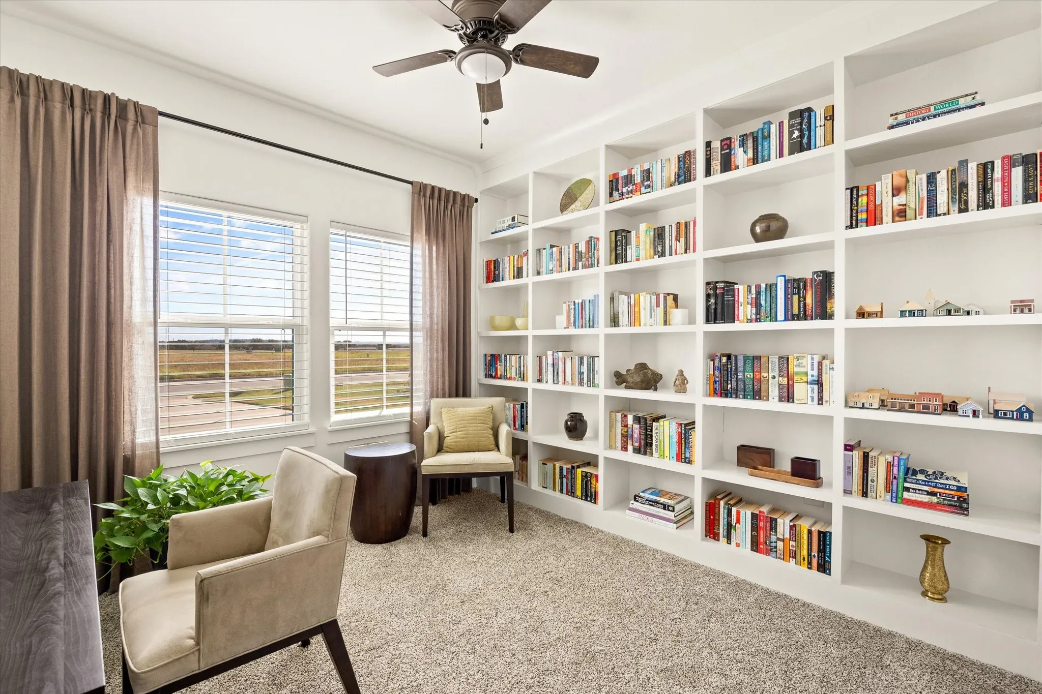 The front bedroom has a wall of built-in bookshelves.