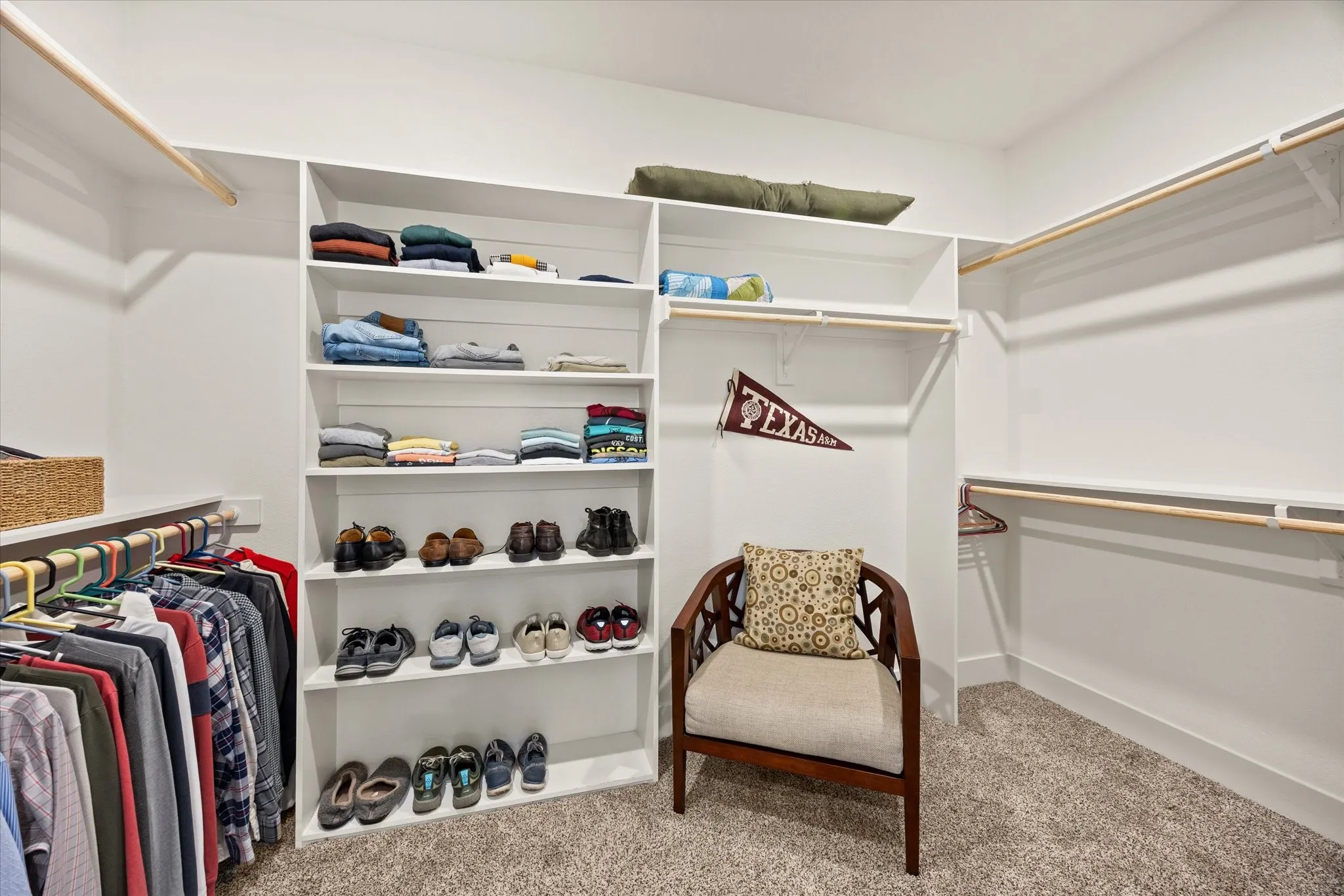 Large closet with copious built-ins.