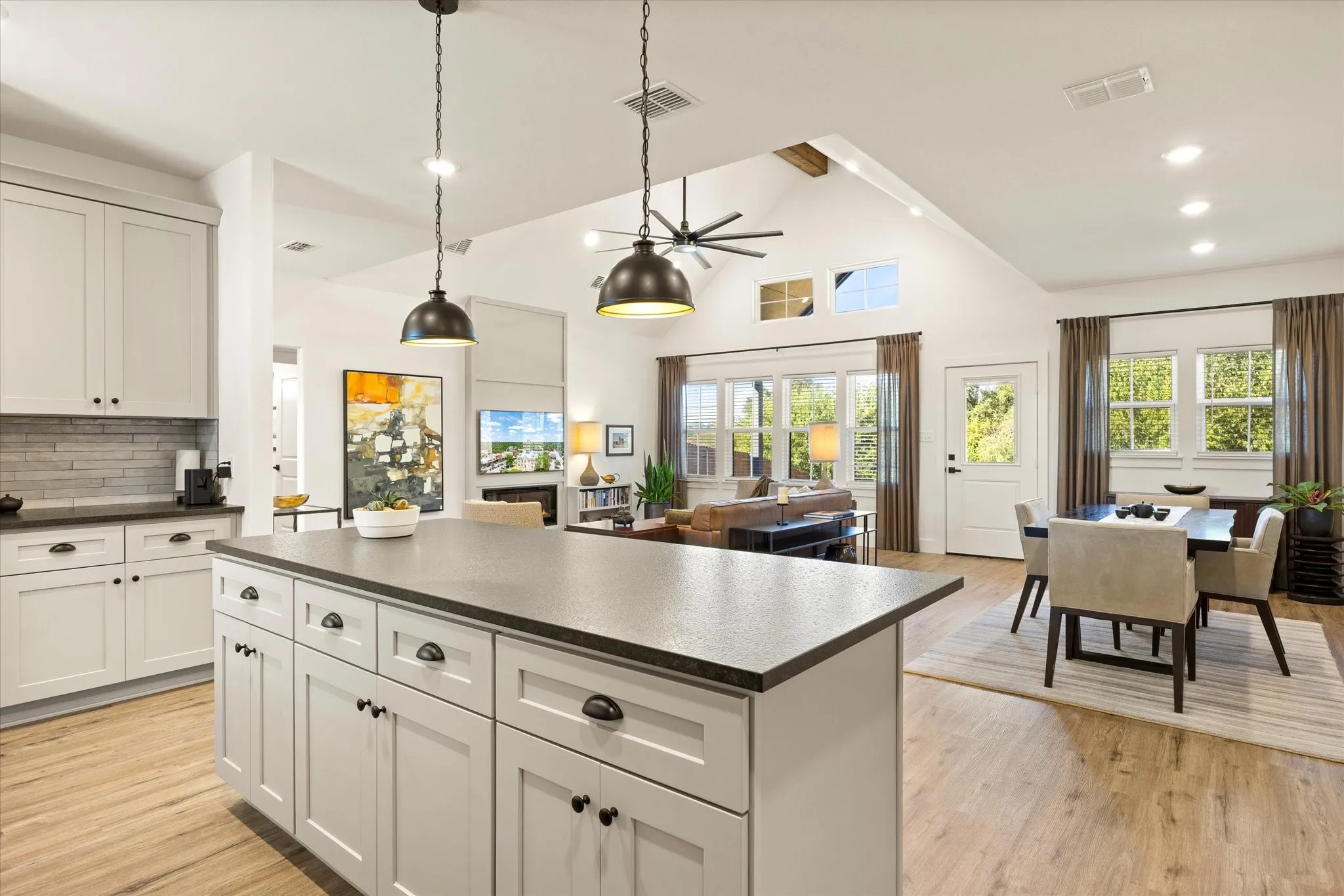 Enjoy the view from the kitchen - windows, TV, open area.