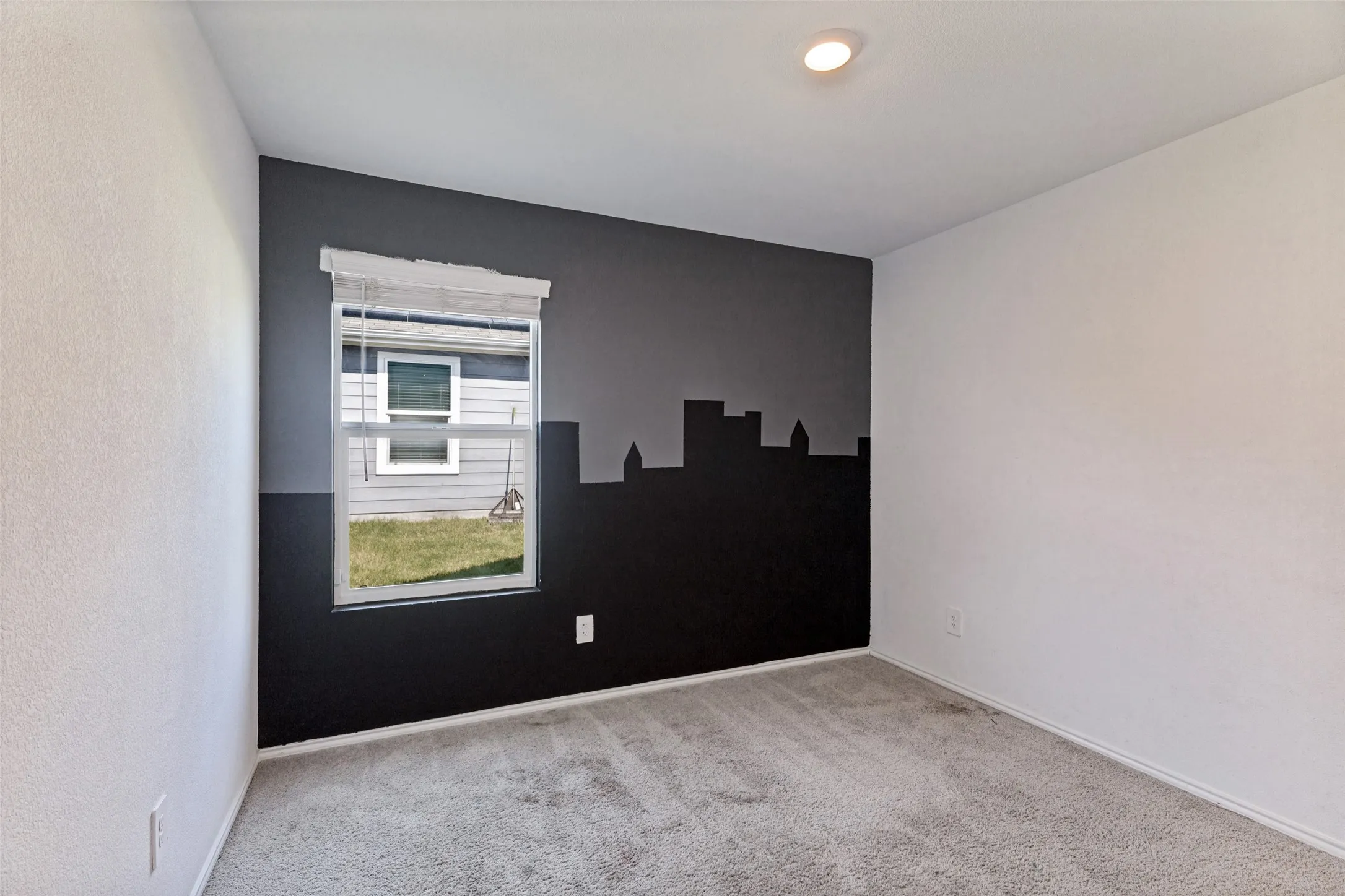 Window with blinds, wall-to-wall carpeting, recessed ceiling light, and painted accent wall