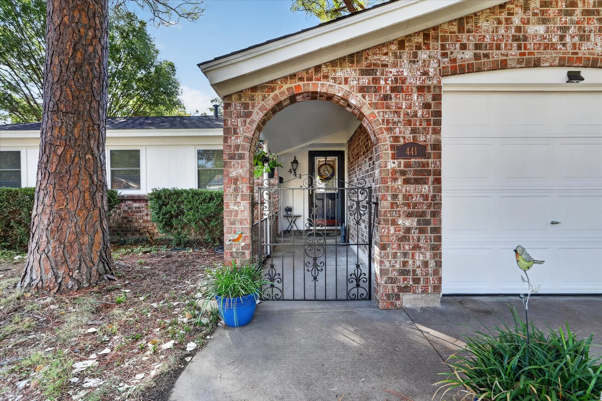 Brick exterior with an arched entryway