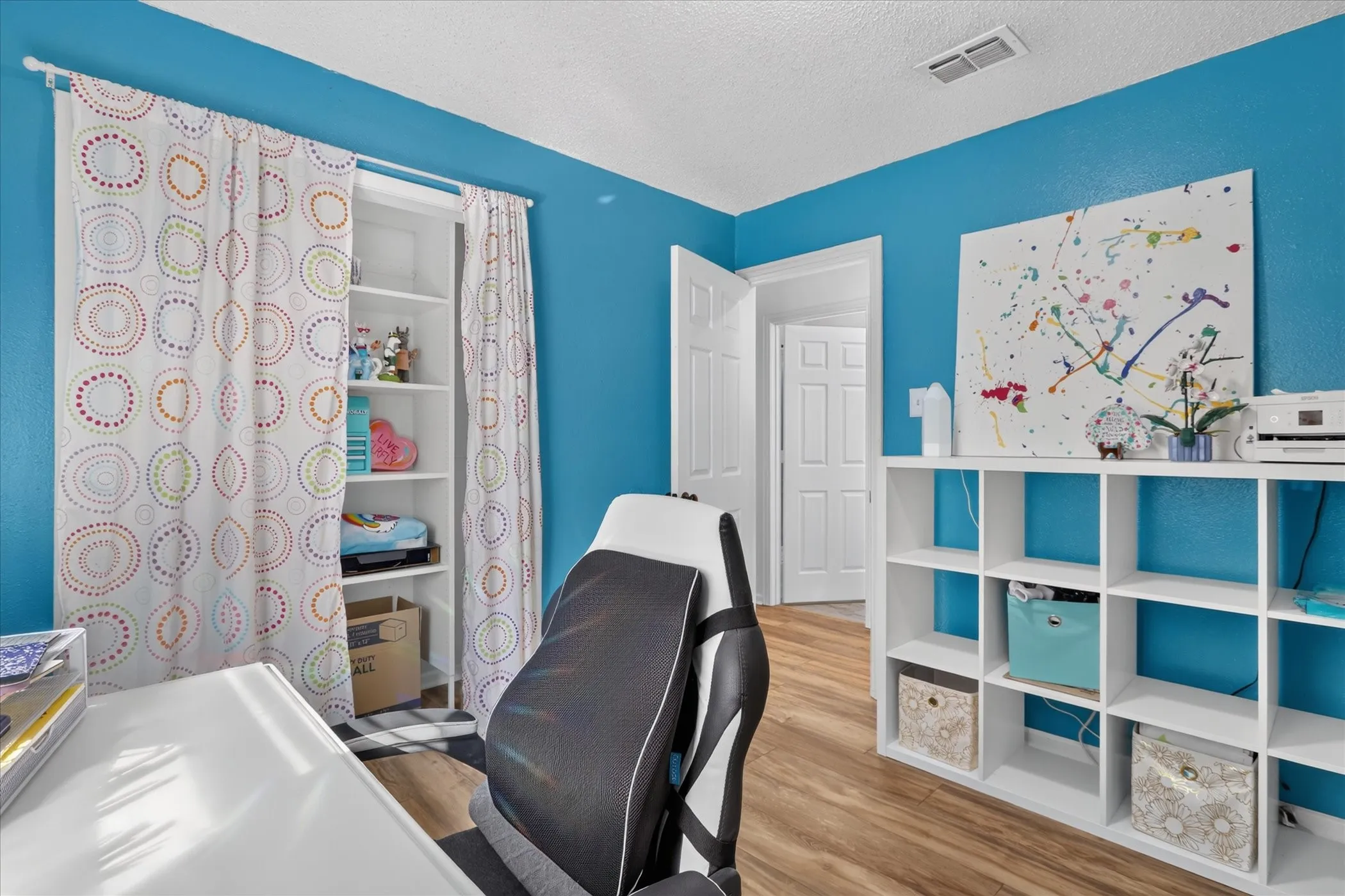 Wood-finish flooring with bright wall color