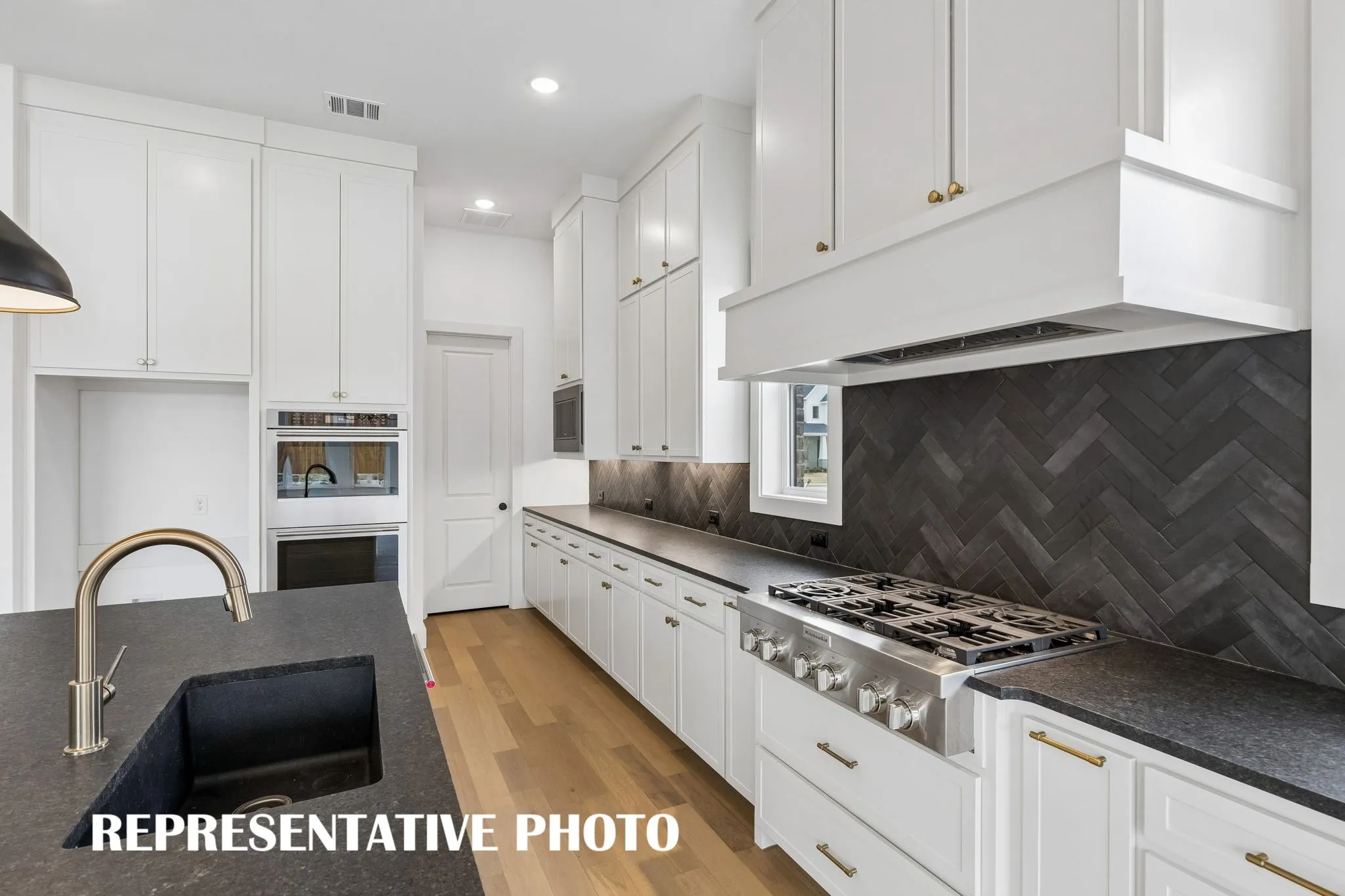Offering classic color palettes, outstanding storage and prep space, all the chef's in the family will love our dream kitchen!  REPRESENTATIVE PHOTO