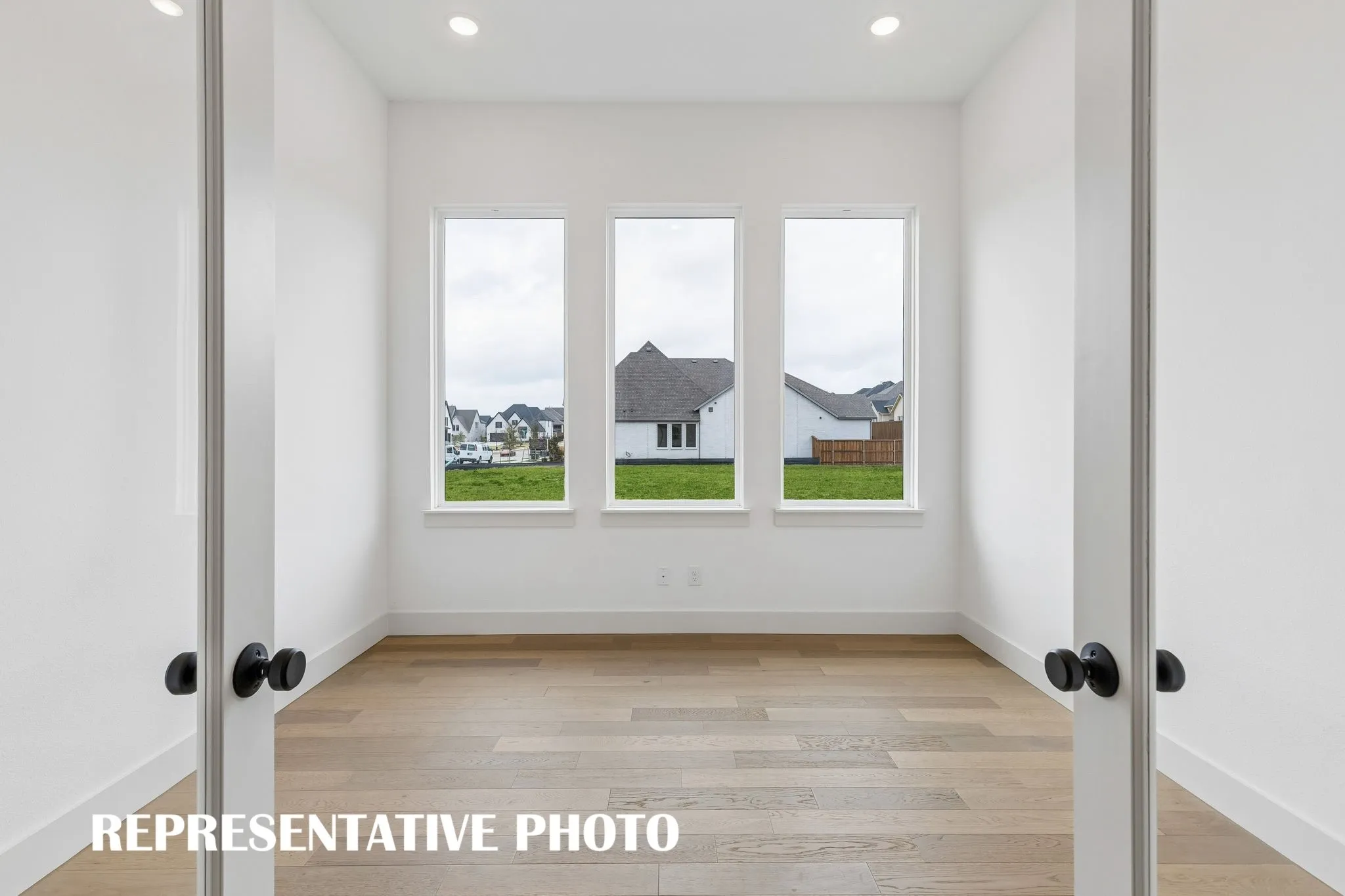 The professional working from home will appreciate this light filled, private home office.  REPRESENTATIVE PHOTO