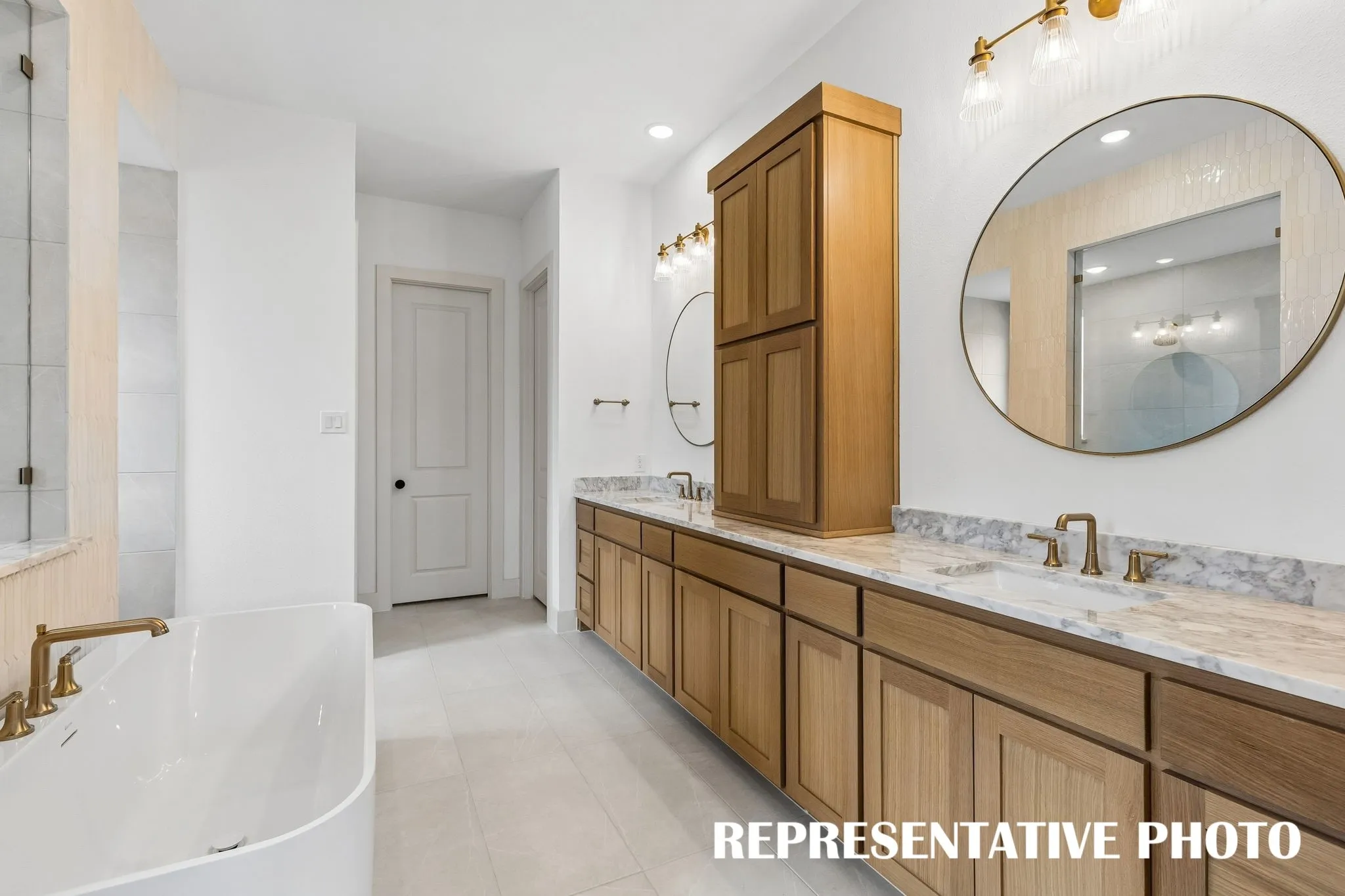 You'll enjoy ample space for two in this dream owner's bath!  REPRESENTATIVE PHOTO