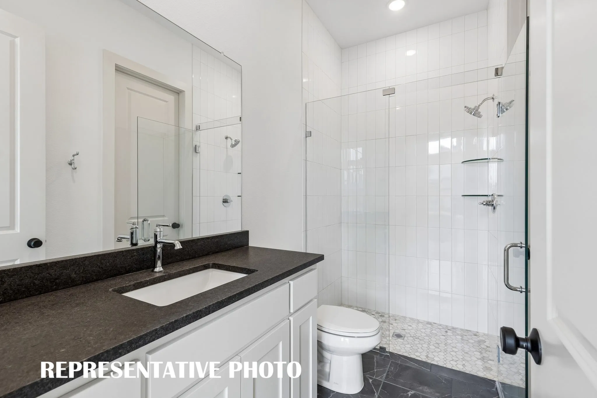 Friends and family will feel right at home in any of the beautifully finished guest baths offered in our Colton plan.  REPRESENTATIVE PHOTO