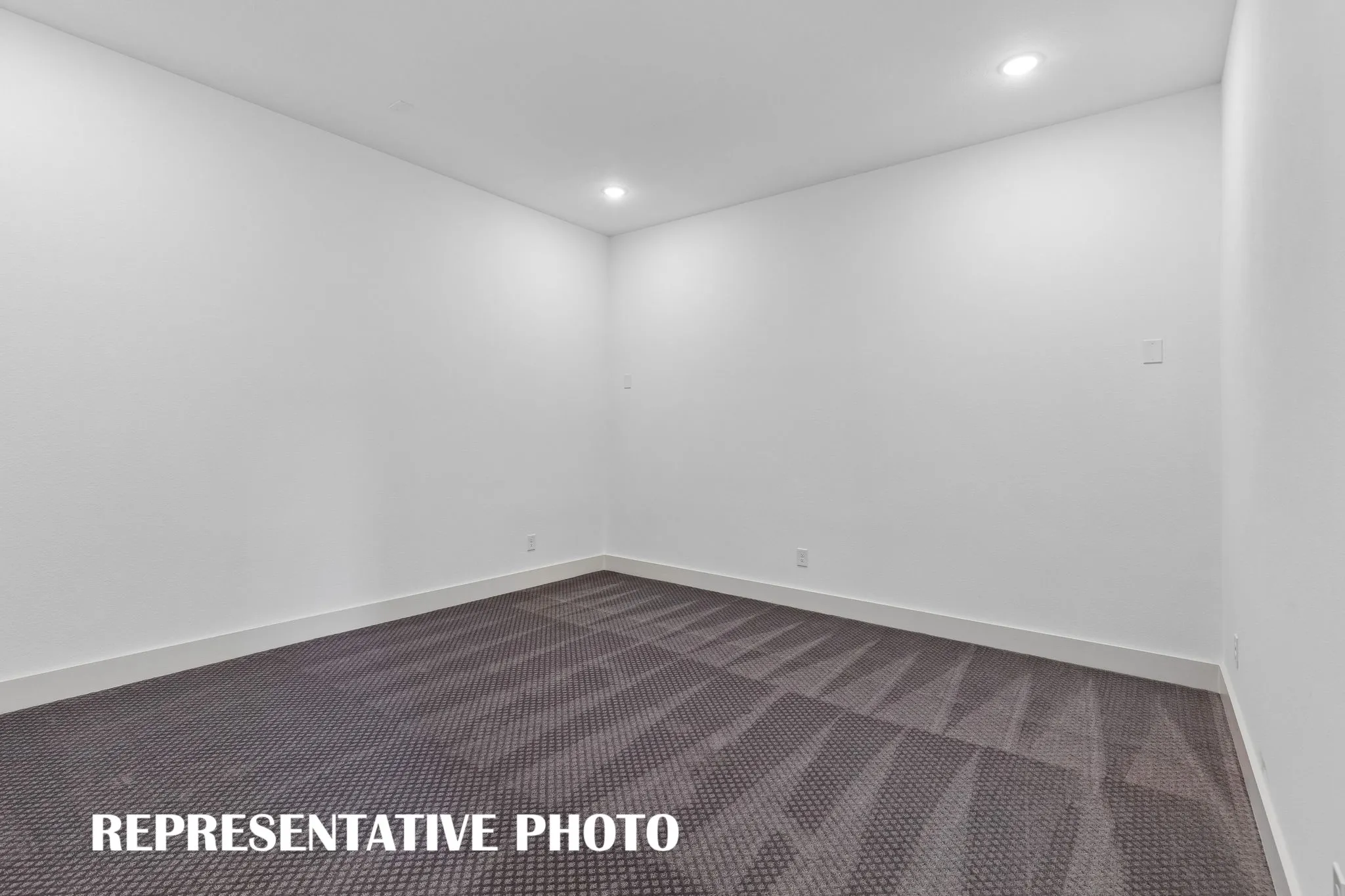 Whether enjoying family movie night or hosting big game day parties, this main floor media room offers outstanding entertaining space.  REPRESENTATIVE PHOTO