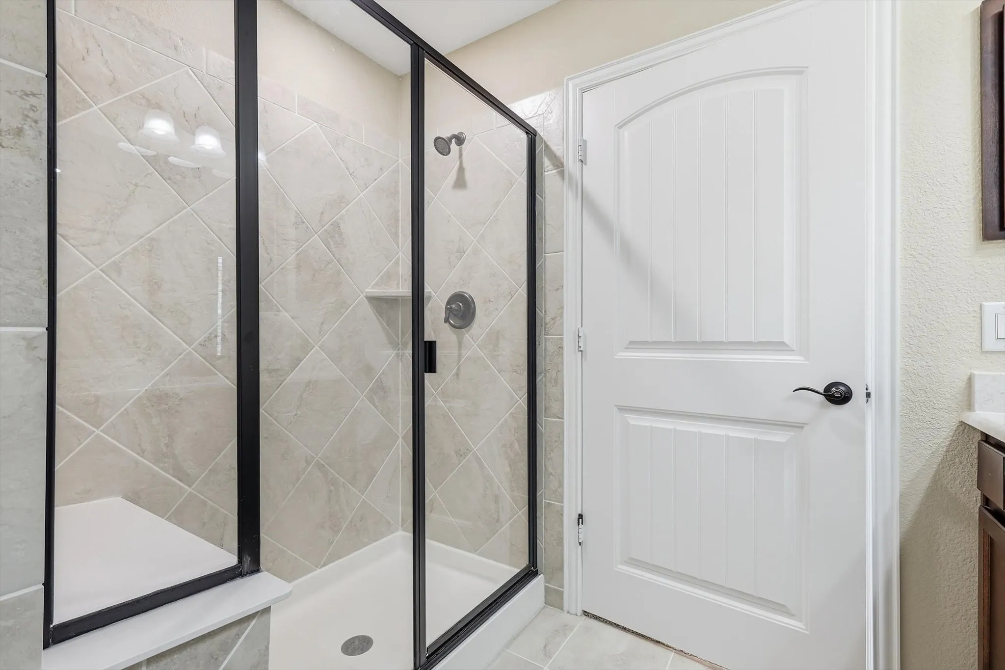 Large walk-in shower with built-in seating