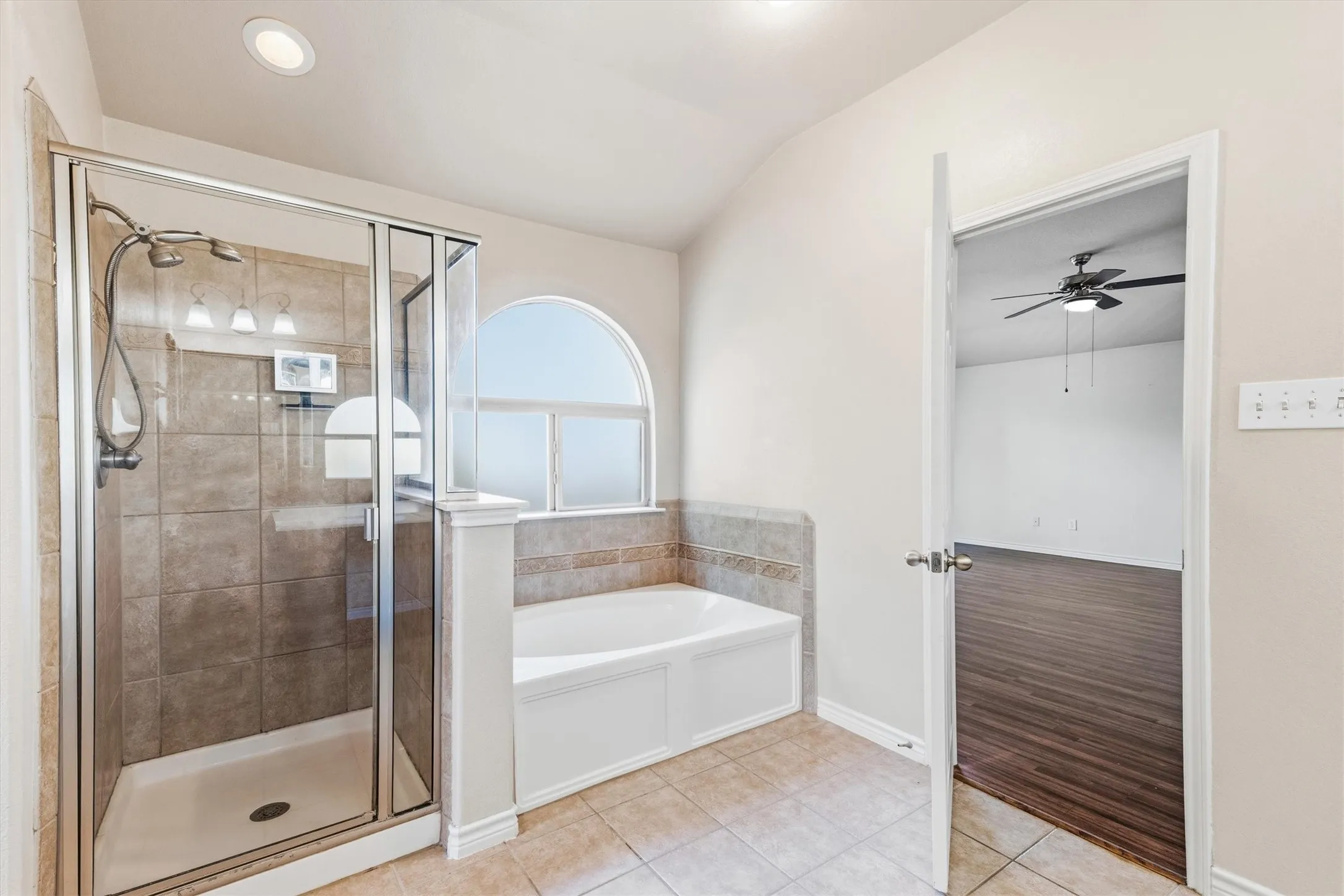 Primary Bathroom, dual sinks, vanity seating. Medicine cabinet. Walk-in shower, bathtub and a second walk-in closet. Private restroom.