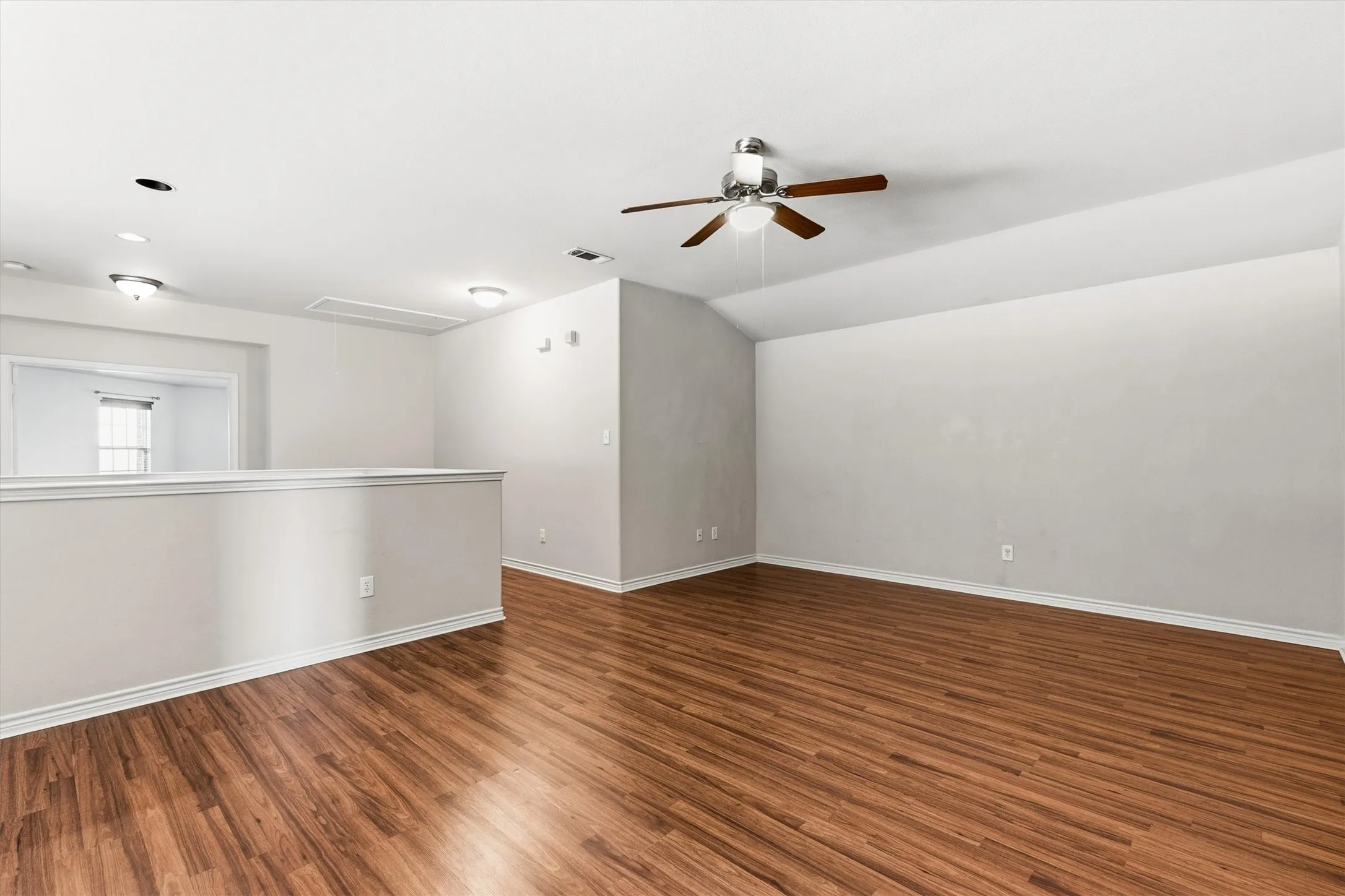 Open Game room, second floor with ceiling fan.