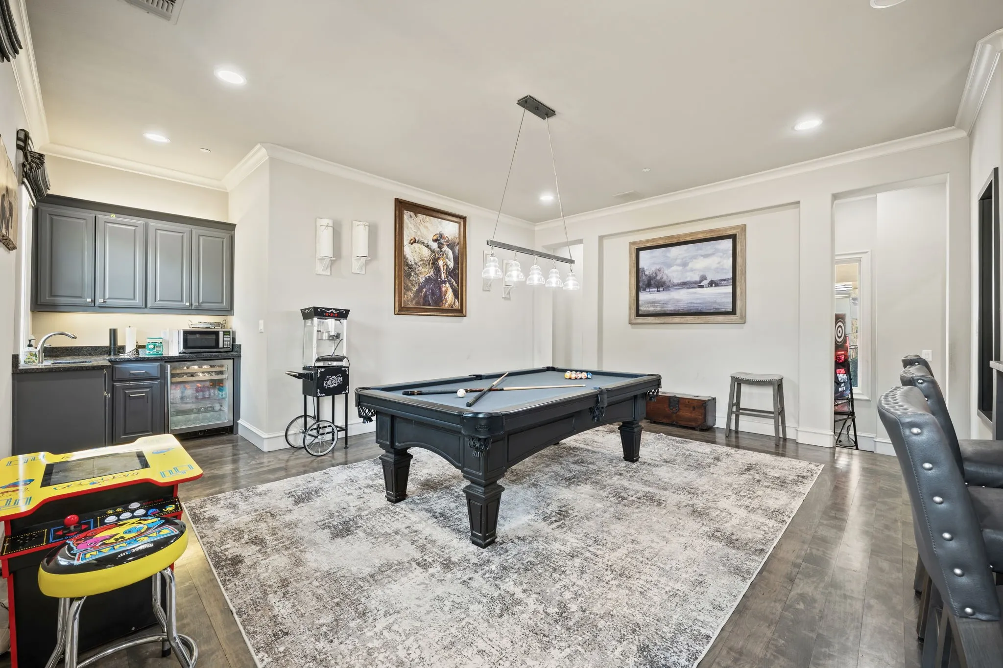 Integrated wet bar with dark cabinetry and built-in beverage​​‌​​​​‌​​‌‌​‌‌​​​‌‌​‌​‌​‌​​​‌​​ refrigerator