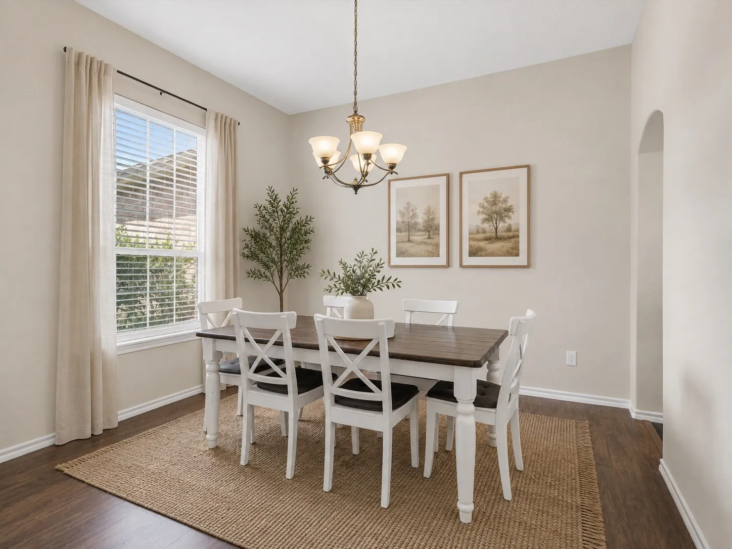 Recessed lighting, wood-finish flooring, and arched entryway