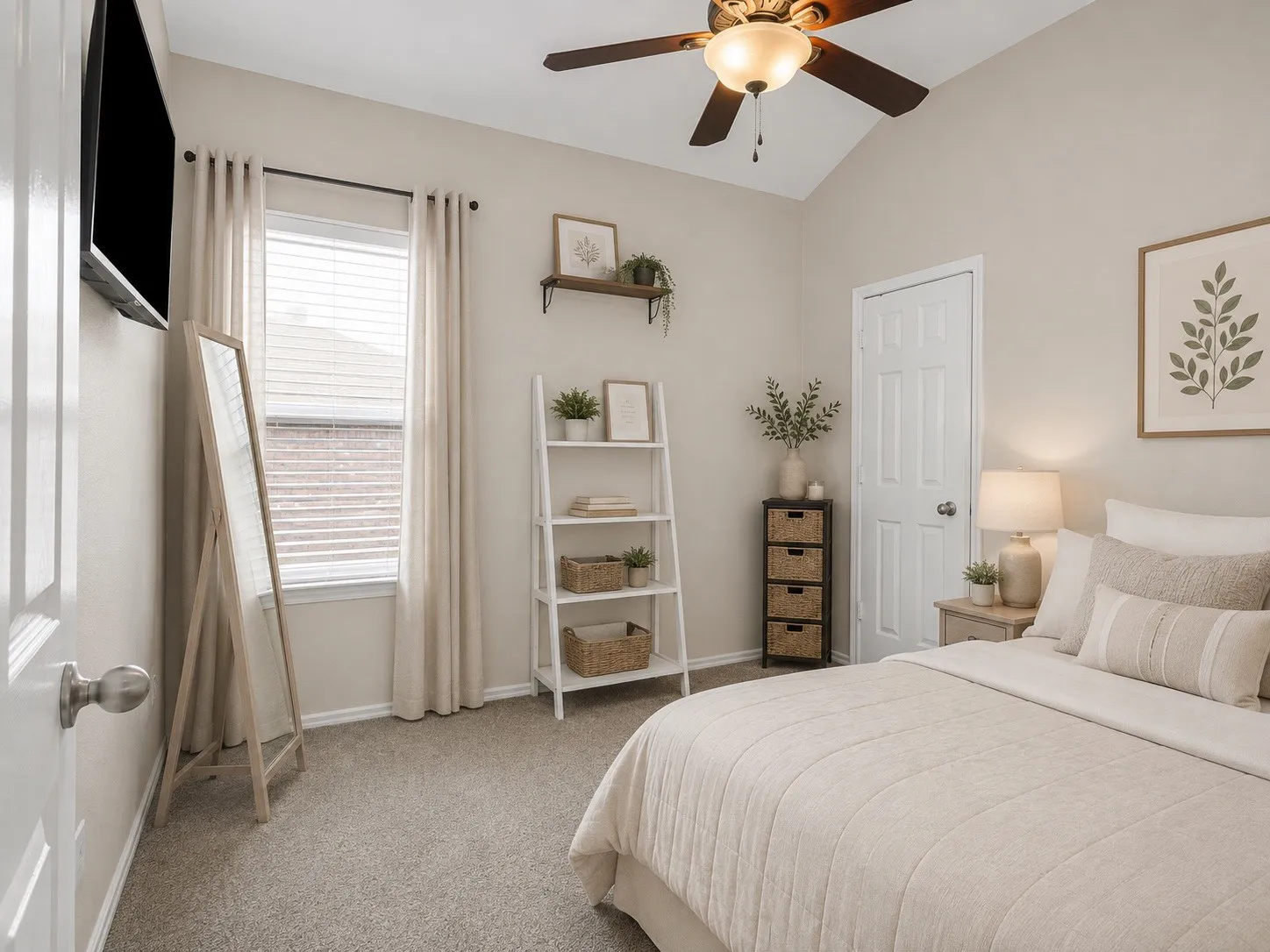 Vaulted ceiling with a ceiling fan, window with blinds and drapes, wall-mounted television, and carpet flooring