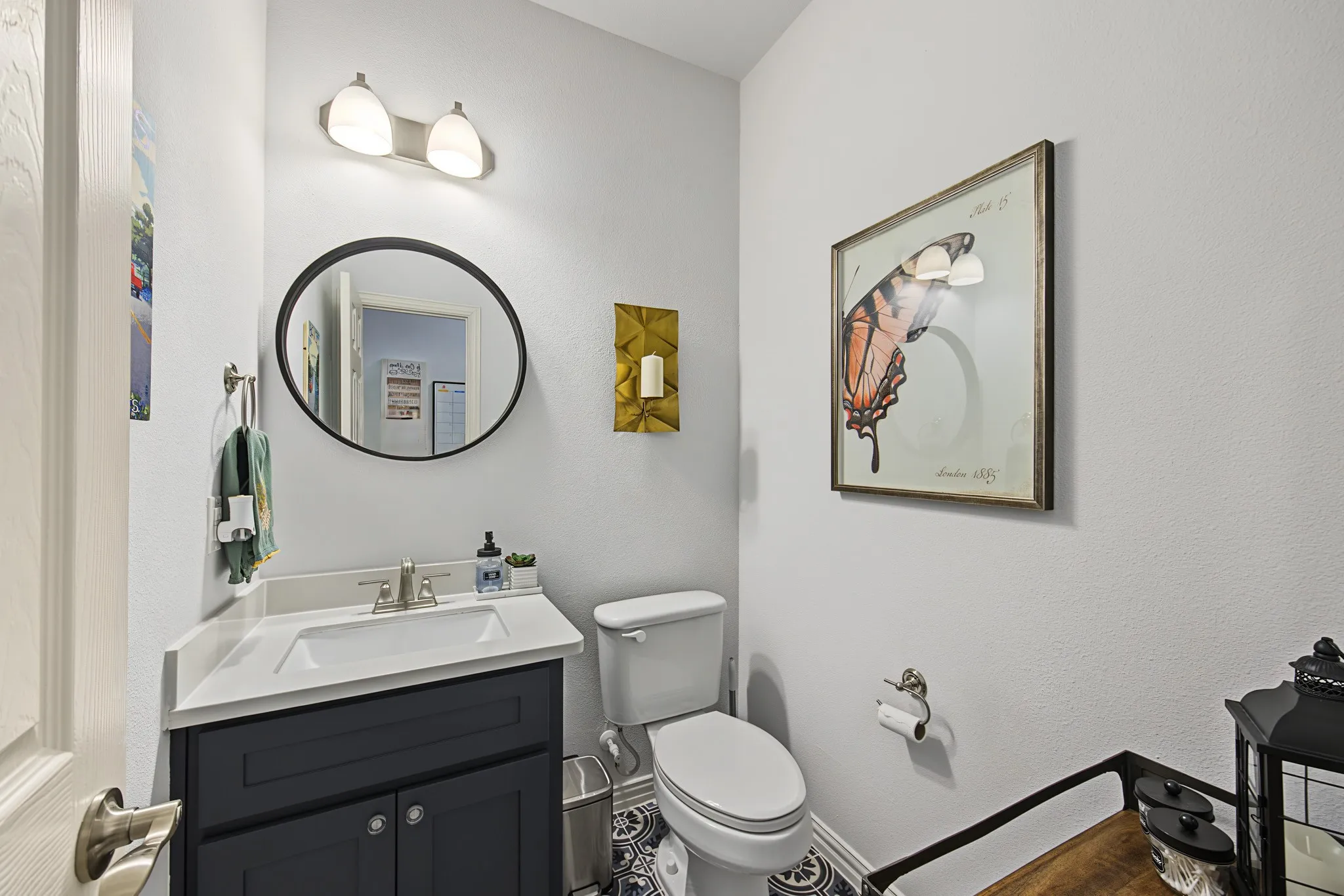 Vanity with an integrated sink, brushed nickel faucet, and dark wood-finish cabinetry
