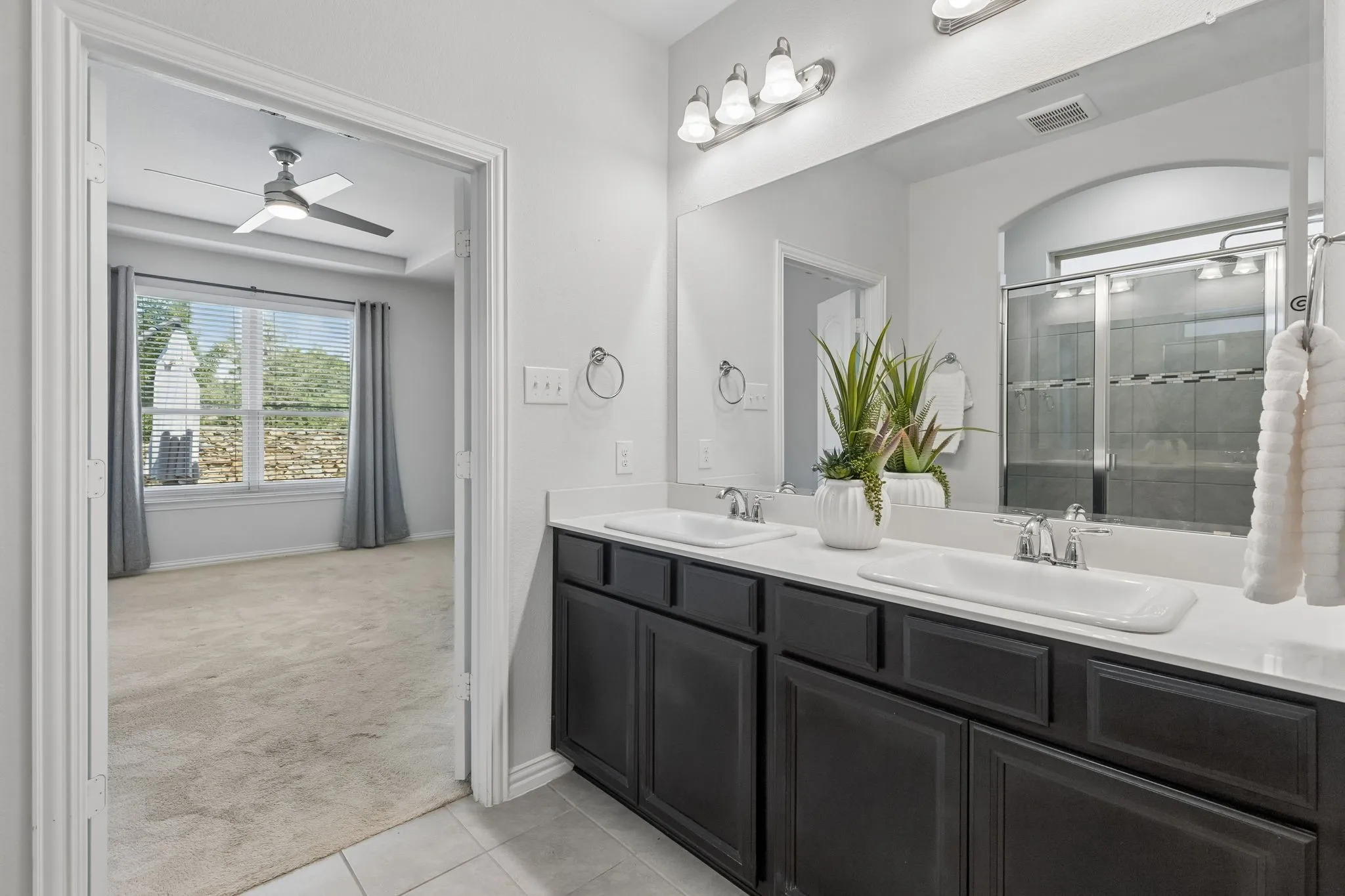 Dual vanity with integrated sinks and white countertops