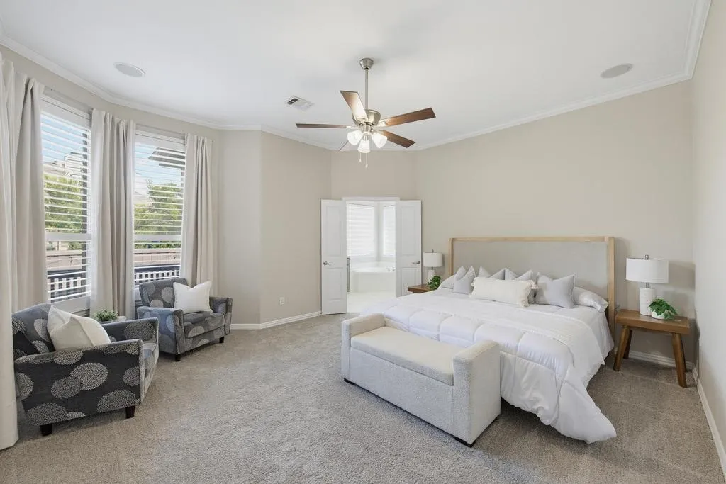 Vaulted ceiling with crown molding, recessed lighting, and a ceiling fan
