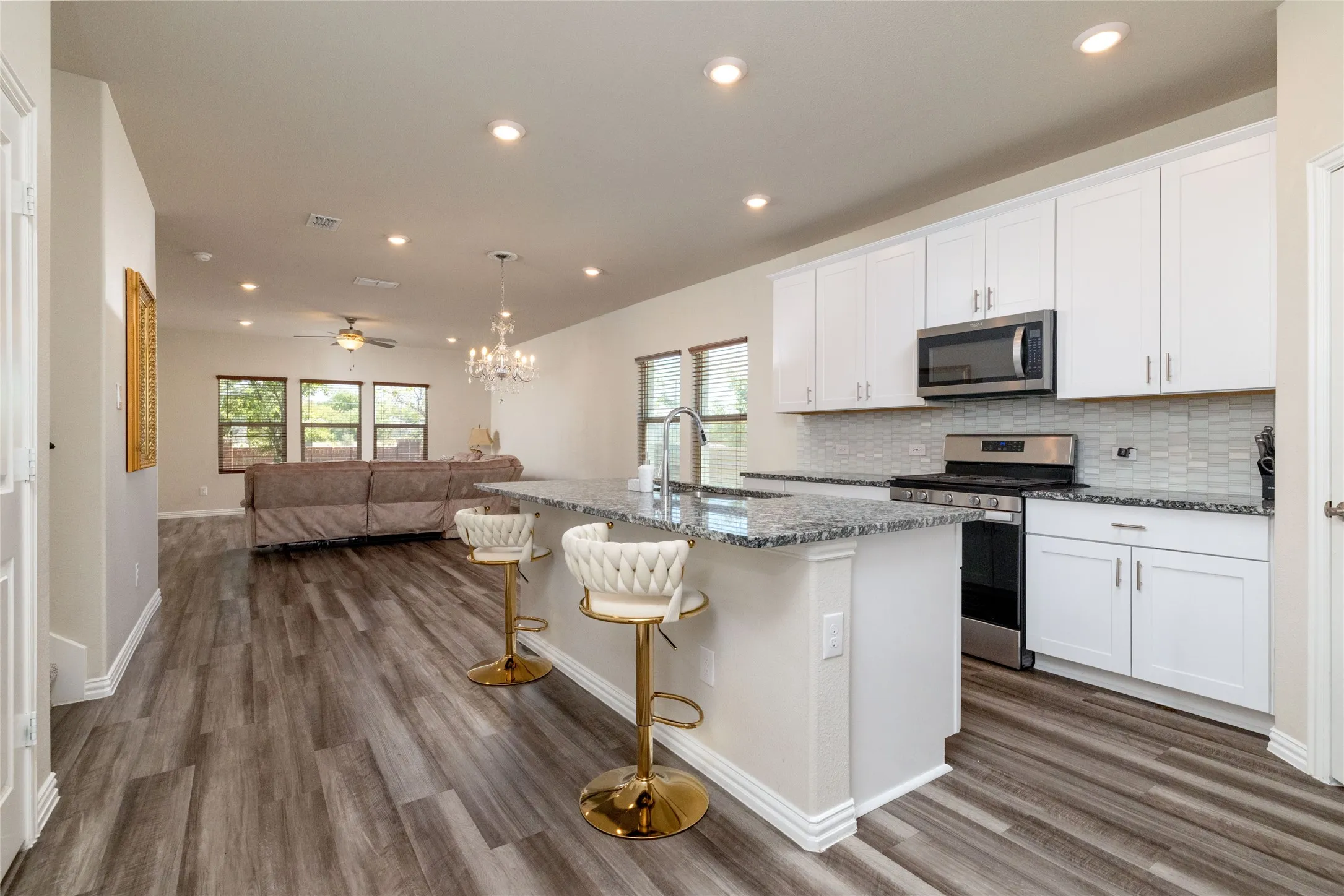 Granite countertops with large center island and gas range
