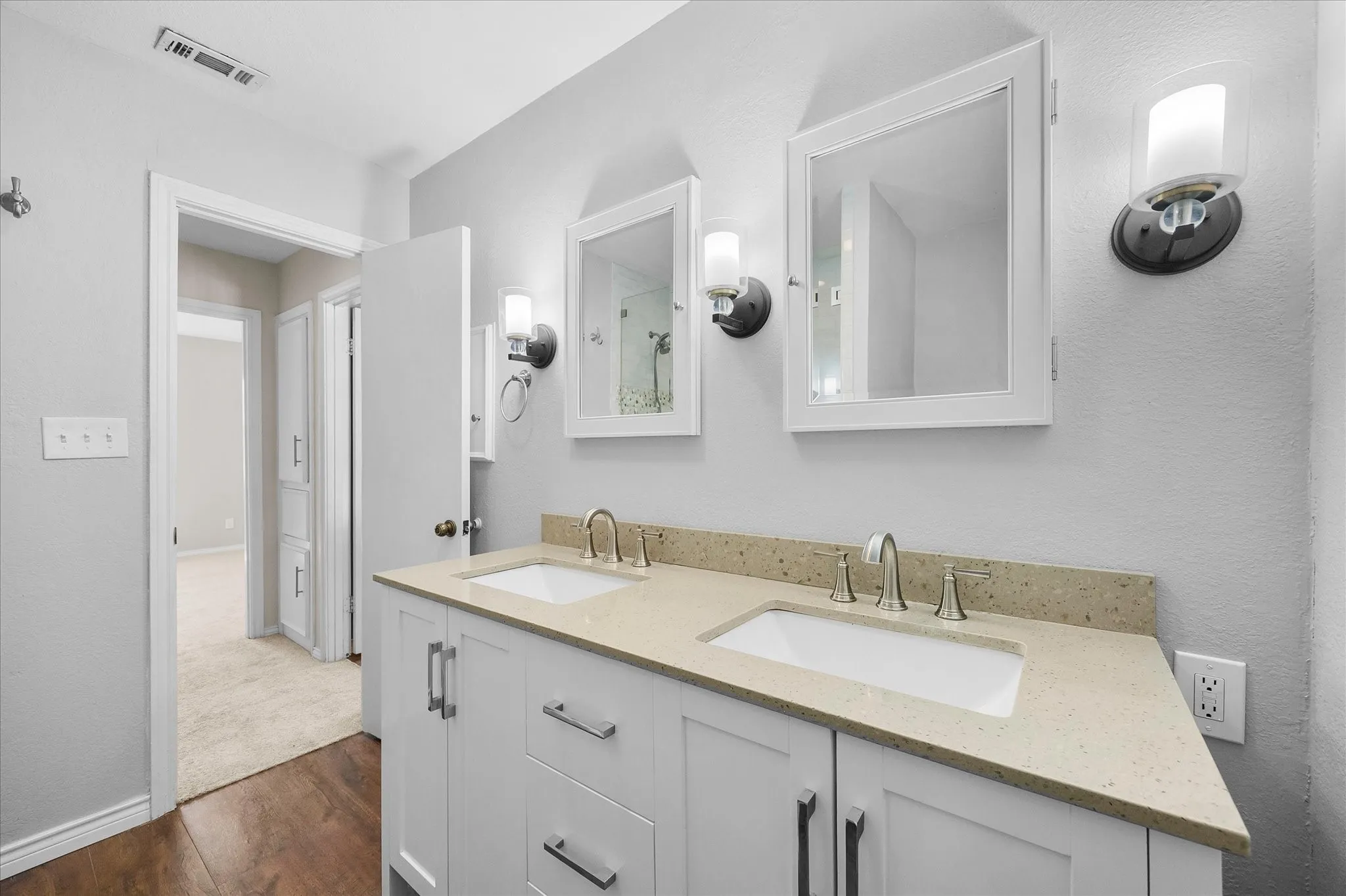 dual sinces, updated lighting, cabinets and hardware are just a few of this home's many amenities