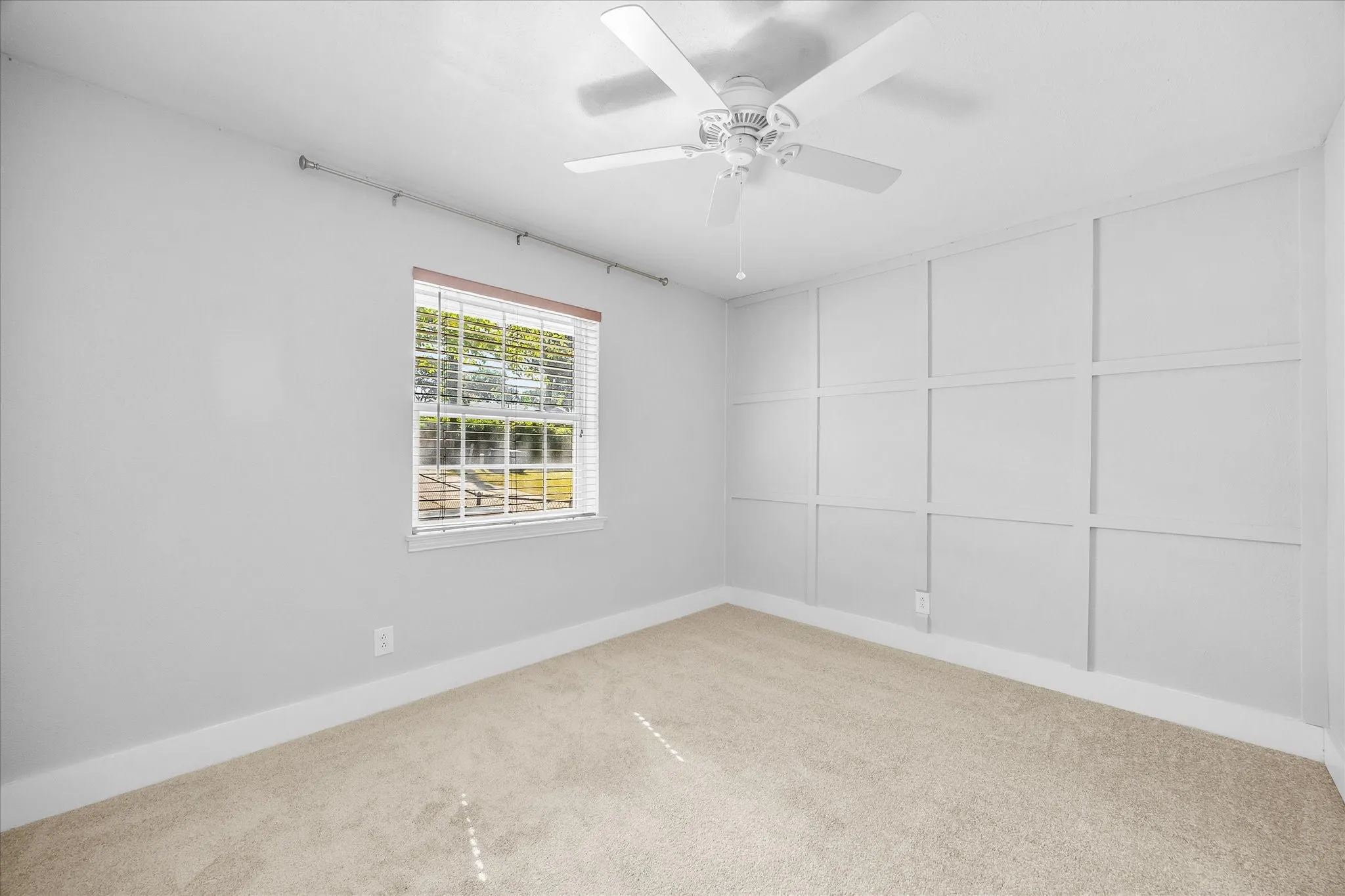 Downstaris guest bedroom can double for home office.