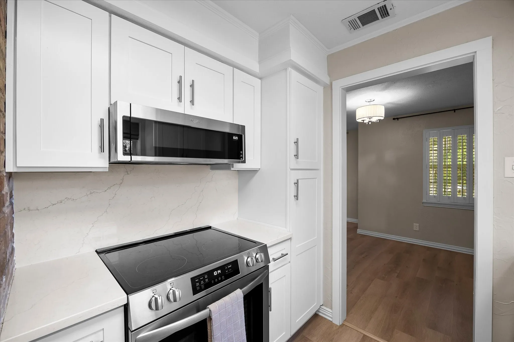 Recently updated kitchen includes built in range, microwave and dishwasher.