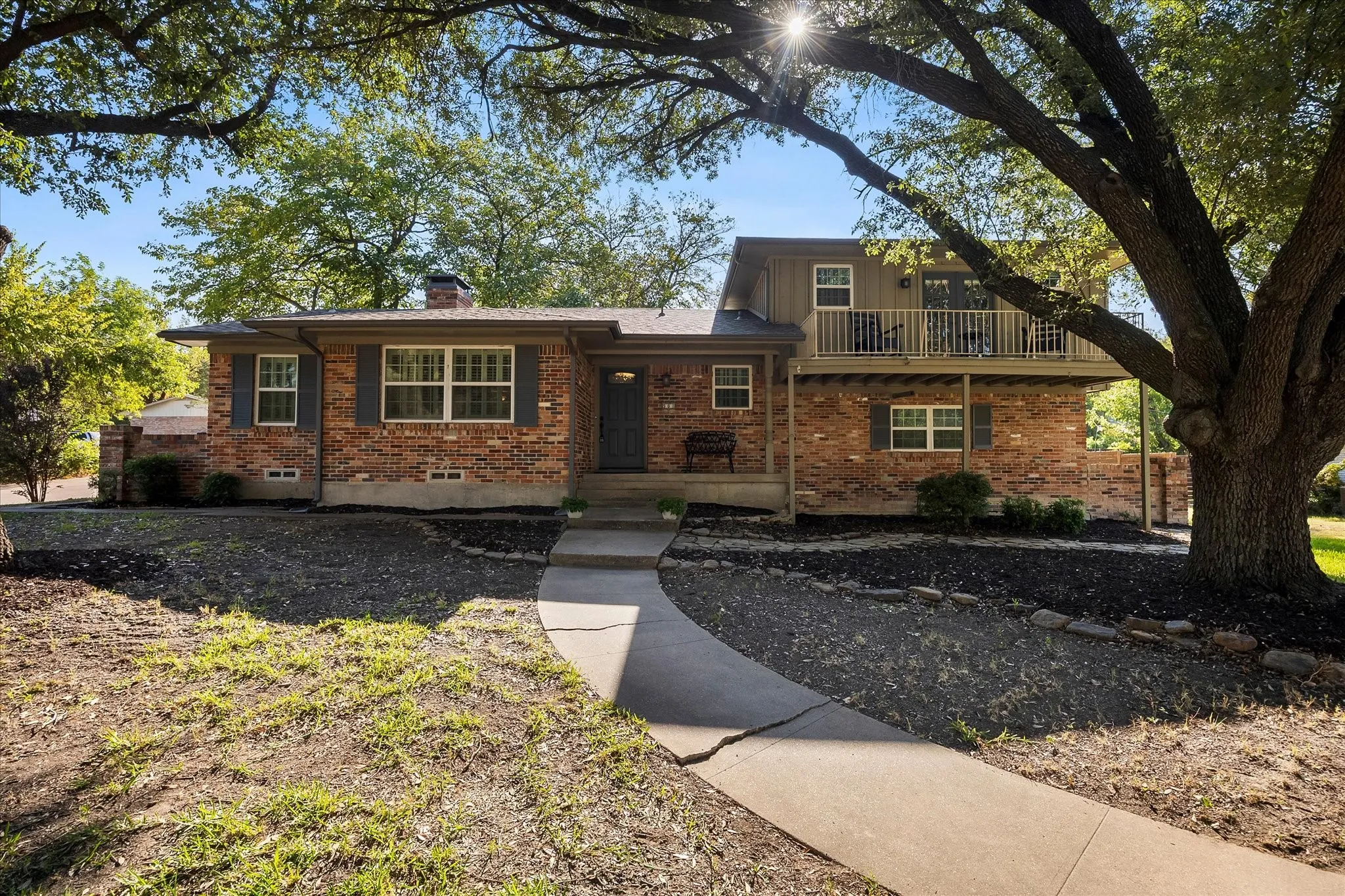 Majestic trees add to this homes lovely curb appeal
