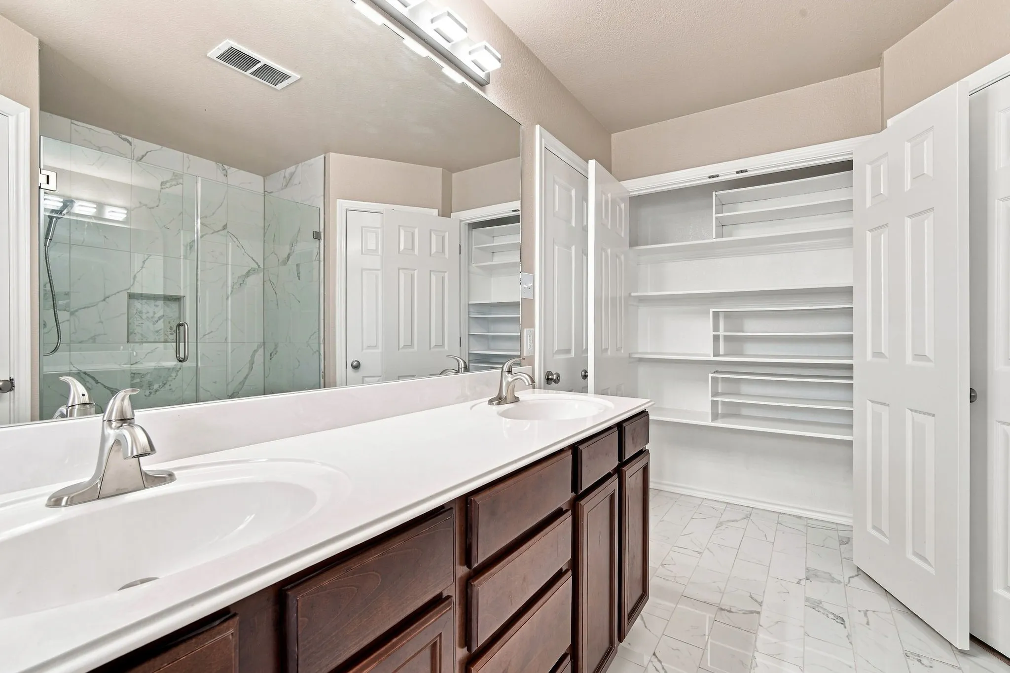 Ensuite with 2 walk-in Closets plus linen closet