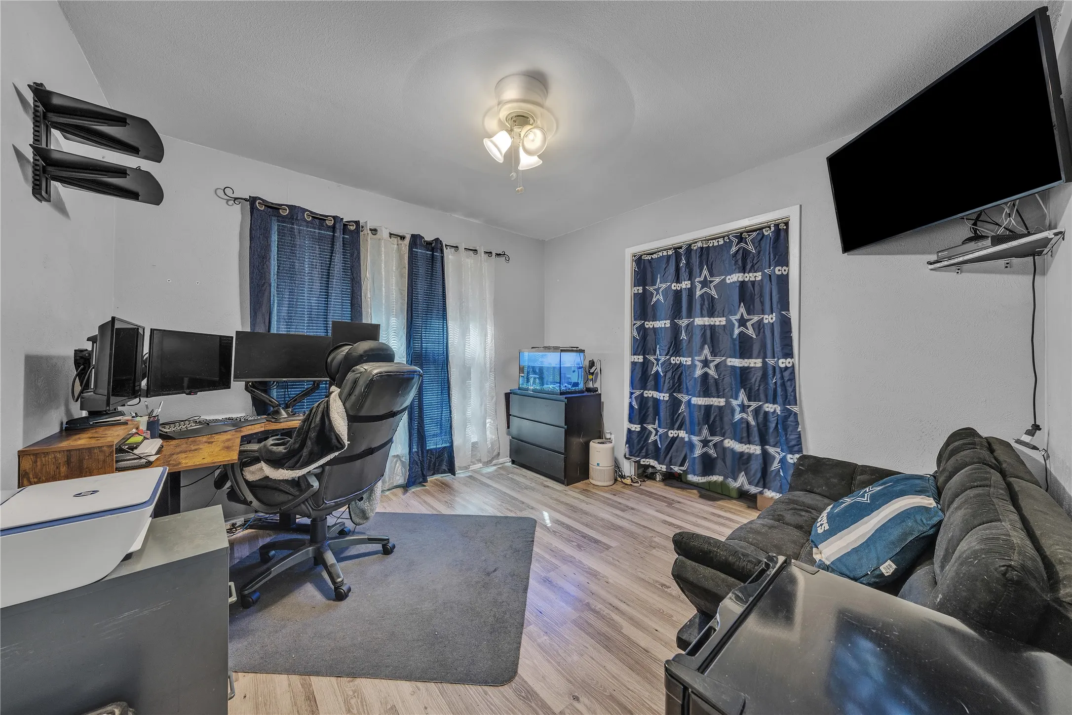 Wood-finish flooring with a ceiling-mounted light fixture