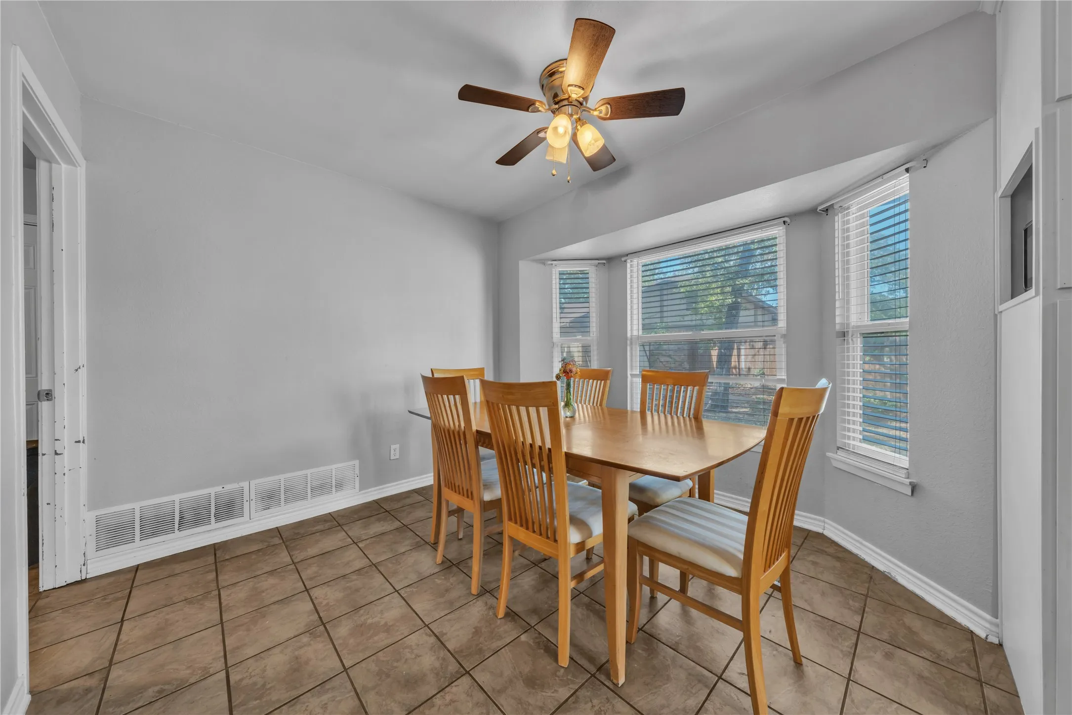 Recessed bay windows provide natural light