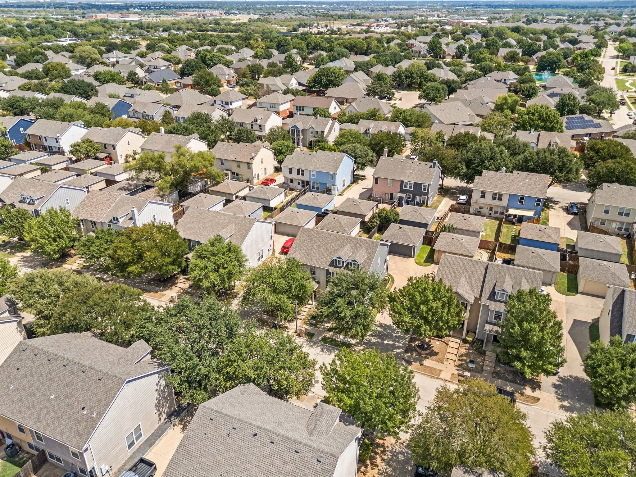 Residential neighborhood featuring mature trees and a cohesive mix of home styles