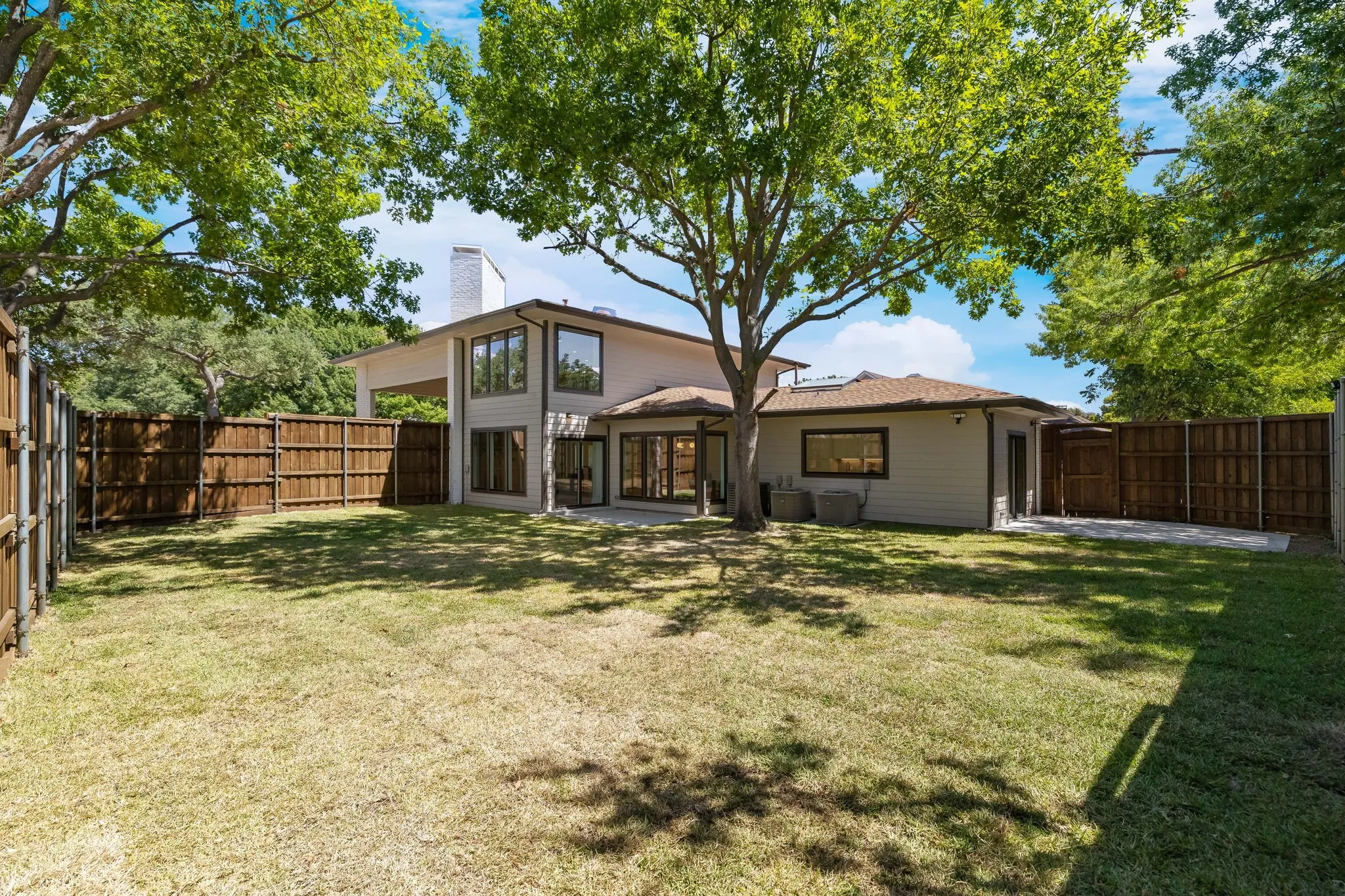 4402 Briargrove-Expansive pool size backyard featuring a large green space, mature trees