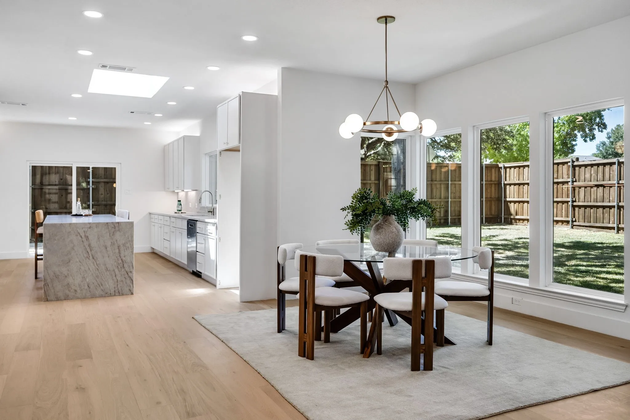 4402 Briargrove-Elegant dining room anchored by a statement designer chandelier