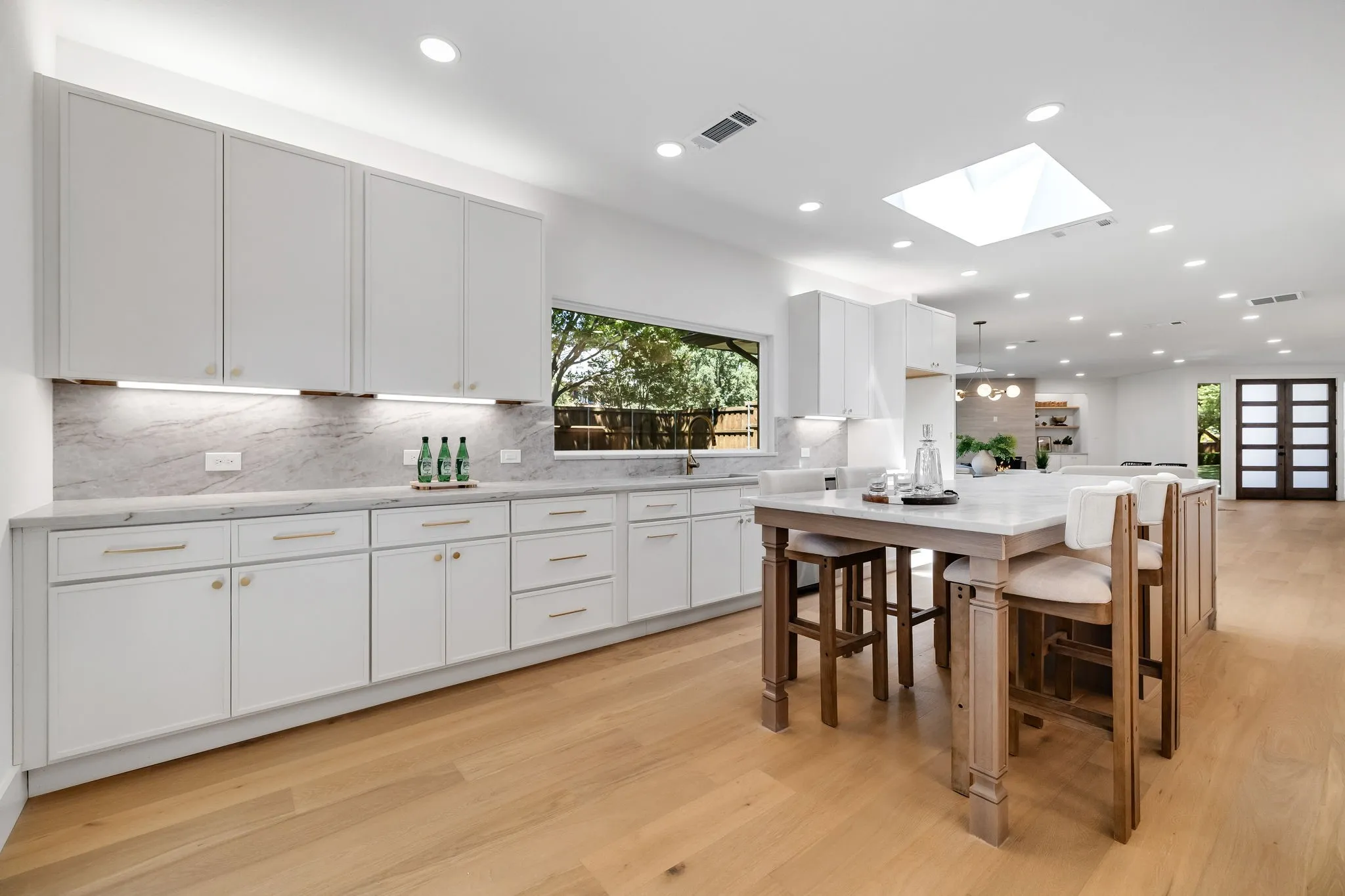 4402 Briargrove-Bright designer kitchen highlighted by a custom picture window that fills the space with natural light.