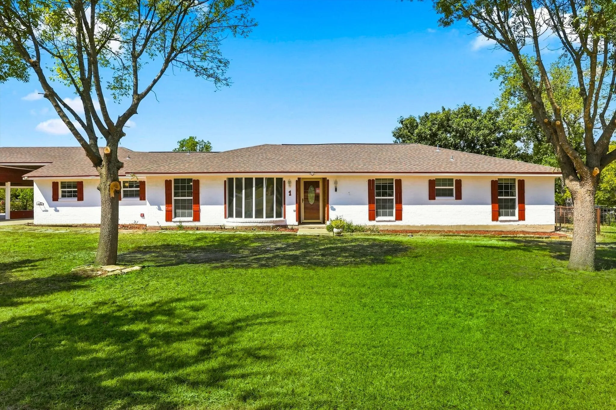1 story ranch with 5 car covered parking. 3 bedrooms, 2 and 1/2 baths.  Large living and huge flex space for game room or additional living space.