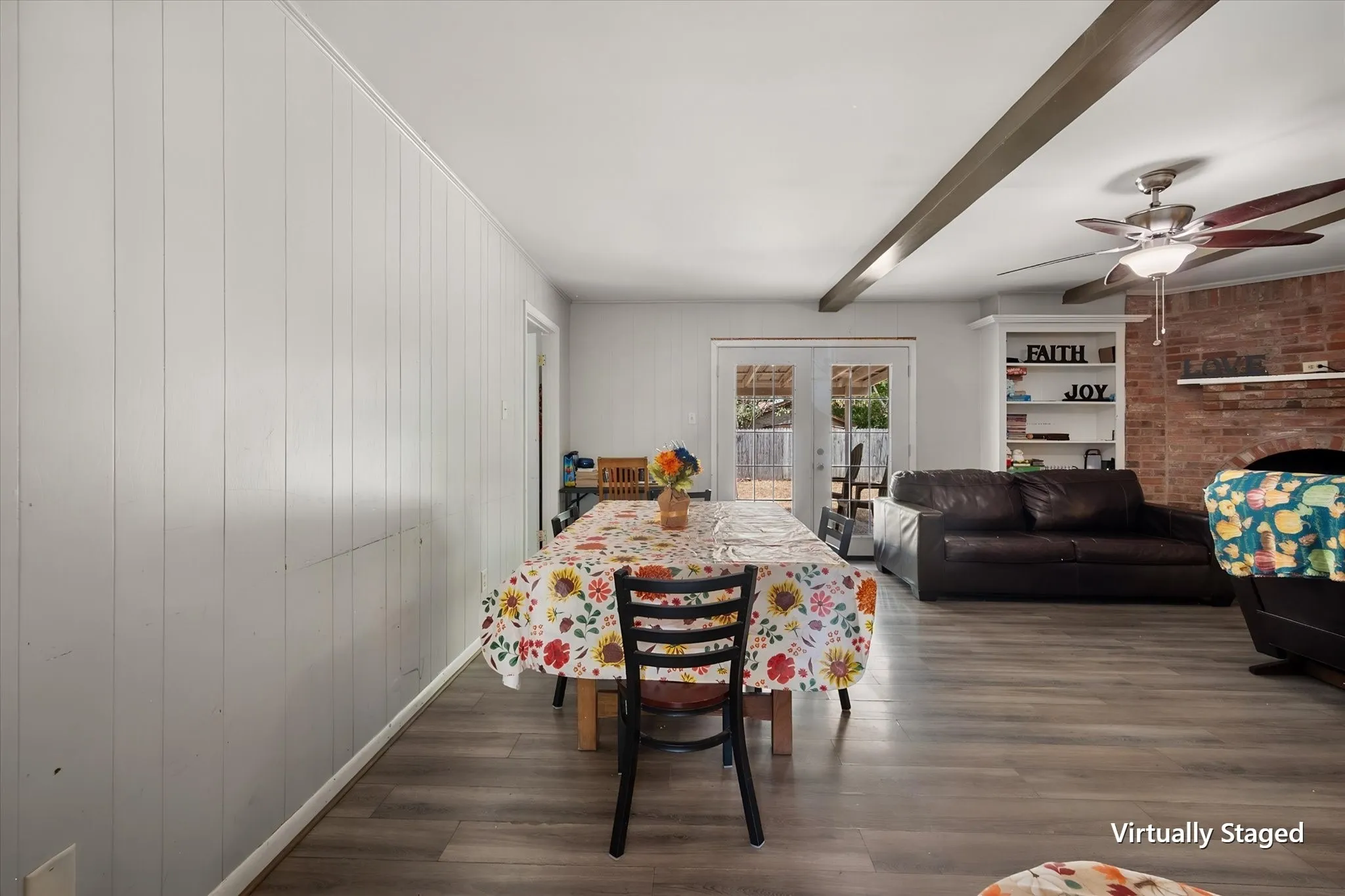 Dining area offers dedicated space for a full dining table while remaining conveniently connected to the main living room.