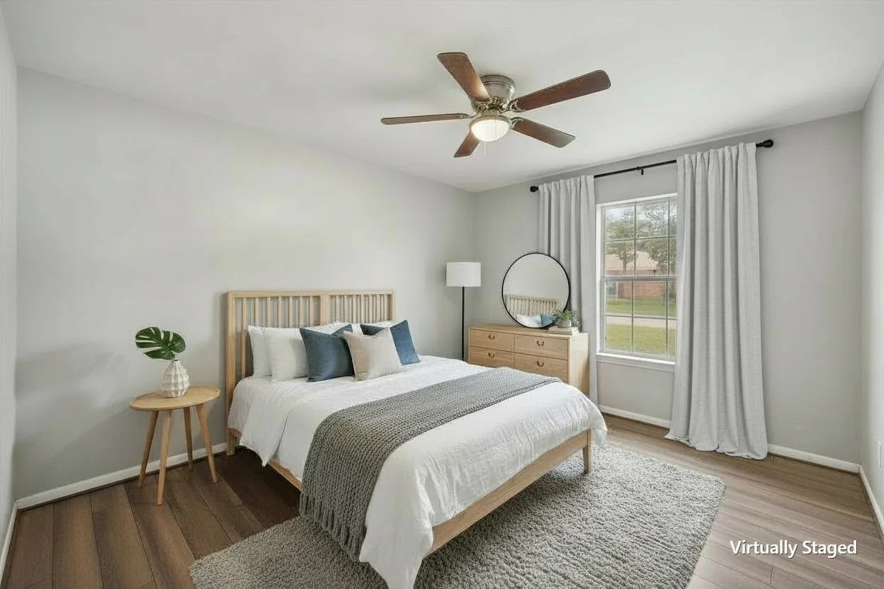 Virtually staged bedroom illustrates another comfortable sleeping space within this 3-bedroom, 2-bath Corsicana TX investment property.