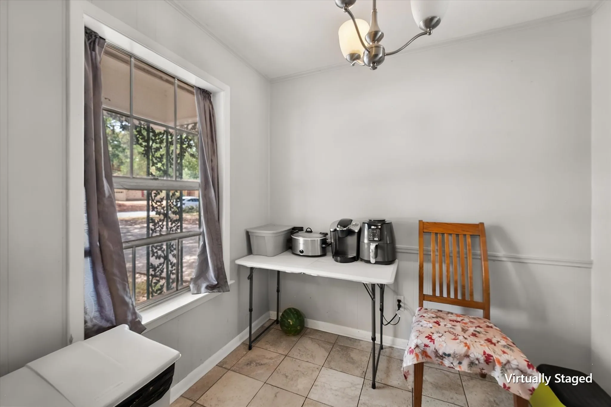 Breakfast area provides convenient casual dining space just beyond the kitchen, adding functionality for tenants or future occupants.