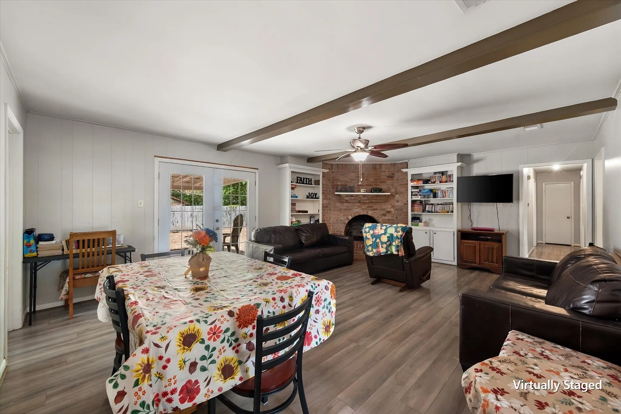 Dining and living areas offer an easy-flowing layout with abundant room for everyday living and entertaining in this tenant-occupied Corsicana home.
