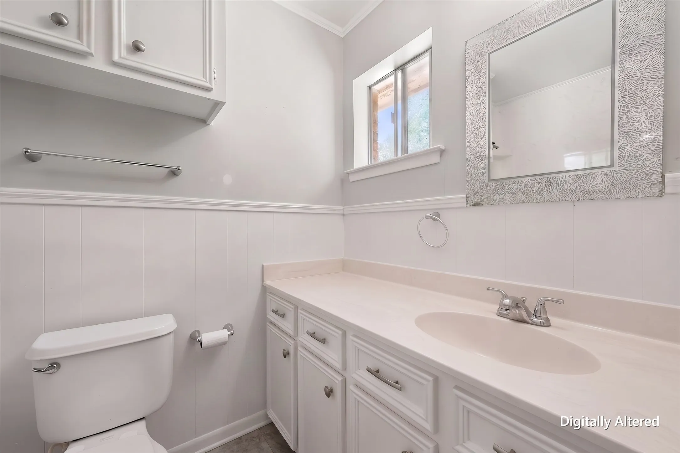 Primary bathroom features a vanity with built-in cabinetry, generous countertop space, and a bright neutral finish.