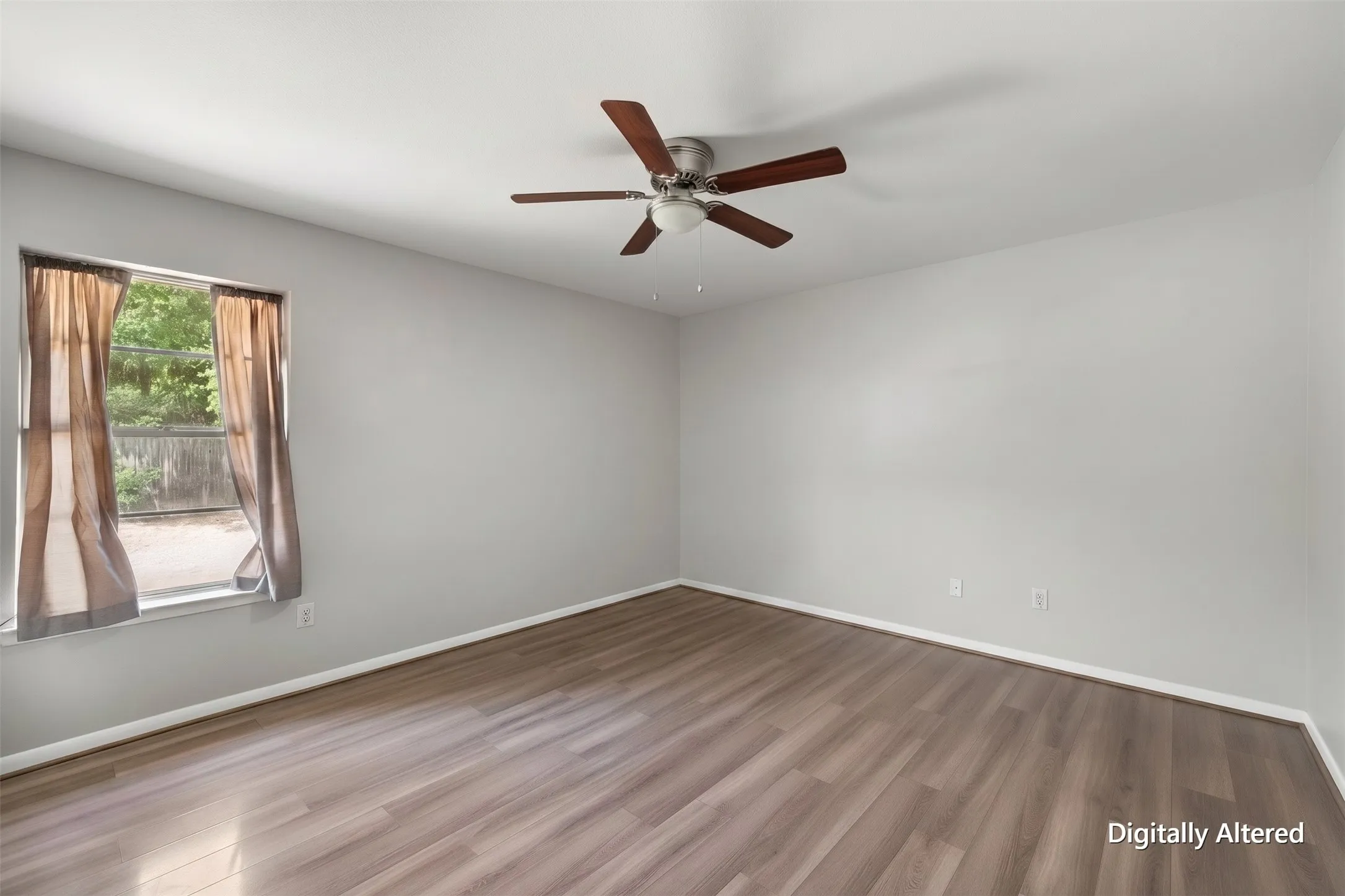 Empty primary bedroom view highlights the generous floor area and neutral finishes, making the room easy for tenants to personalize.
