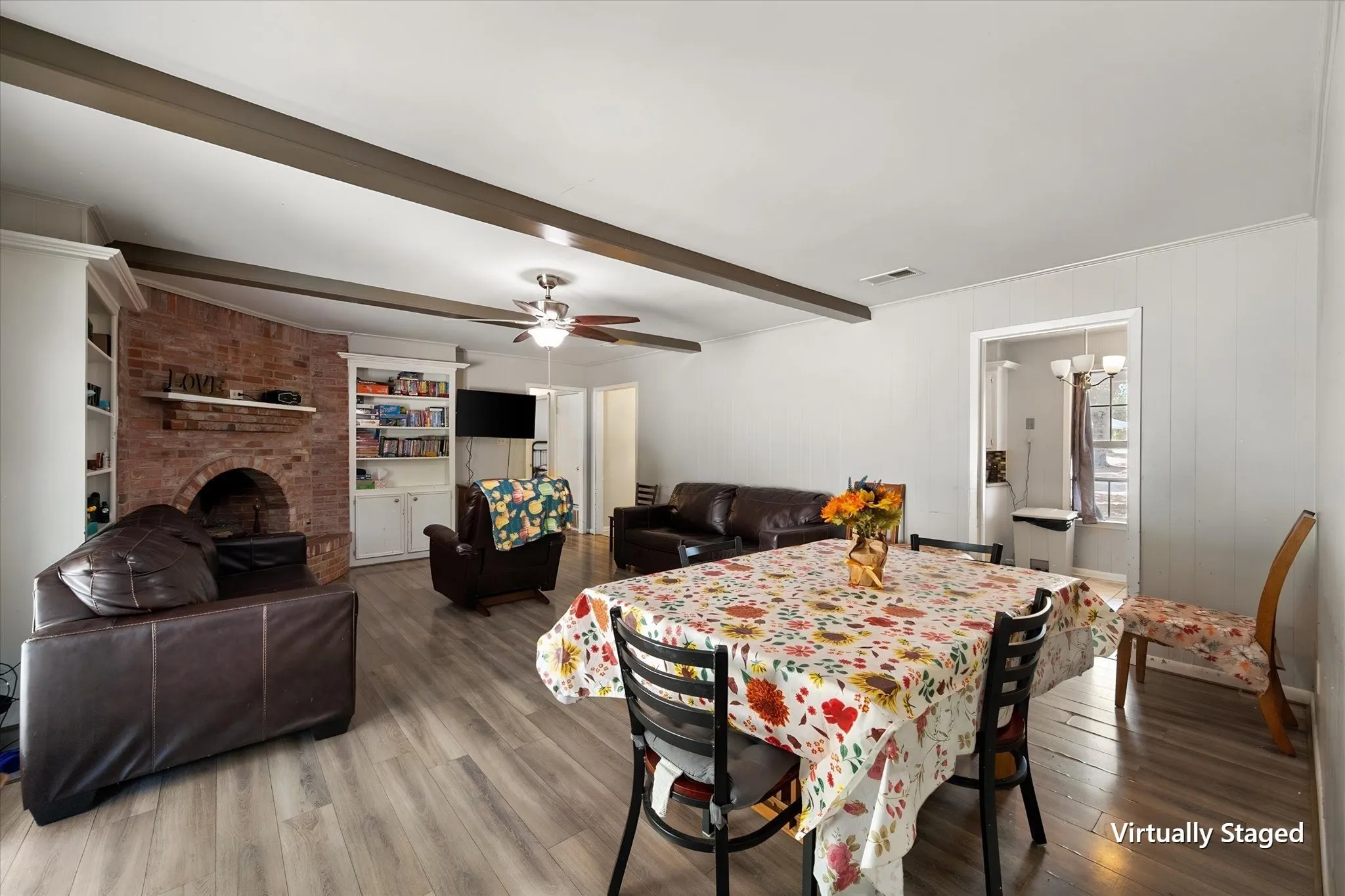 Open living and dining space demonstrates the functional floor plan and comfortable gathering areas offered by this Corsicana TX investment home.