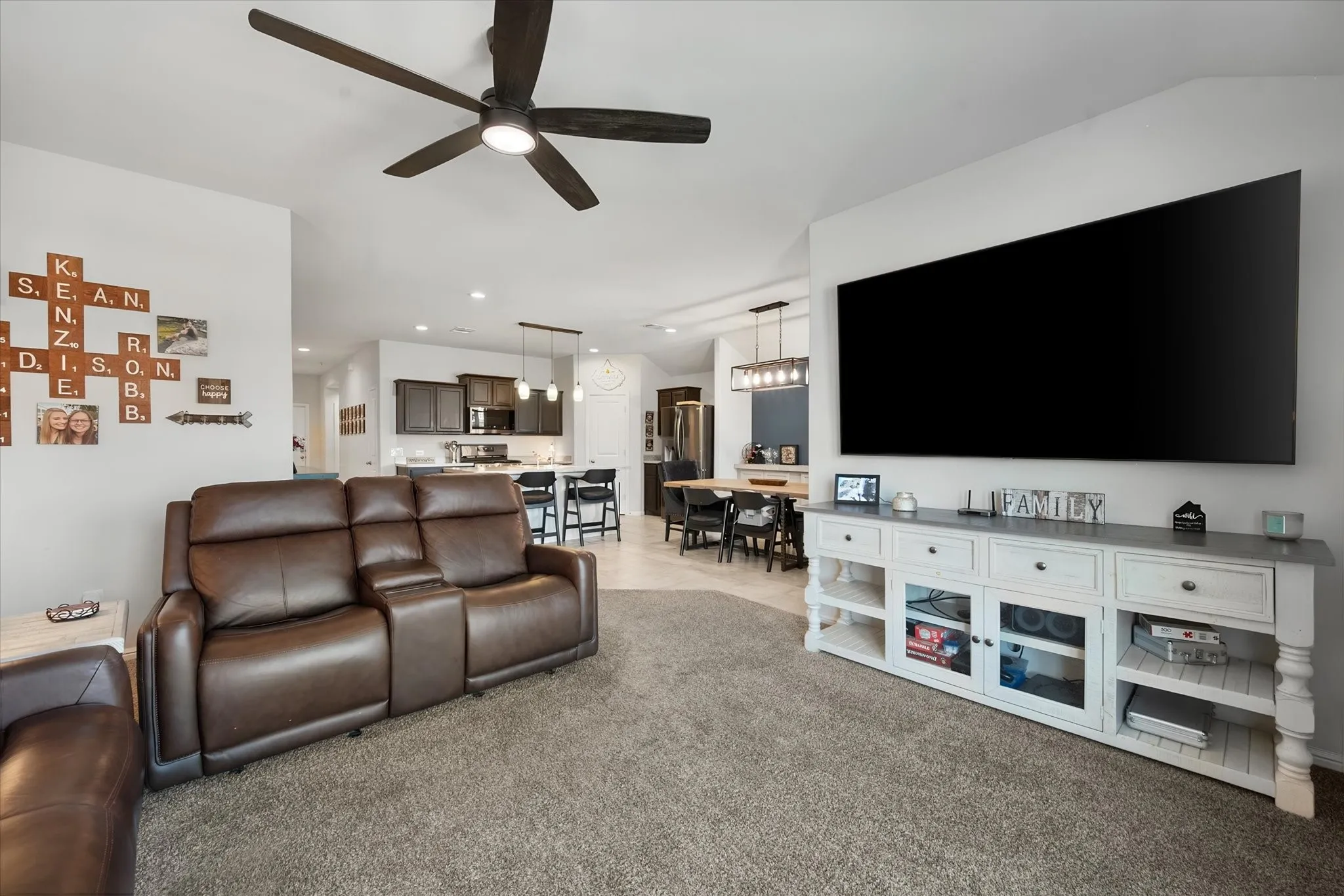 Open-concept living space looking back towards the kitchen and dining area!