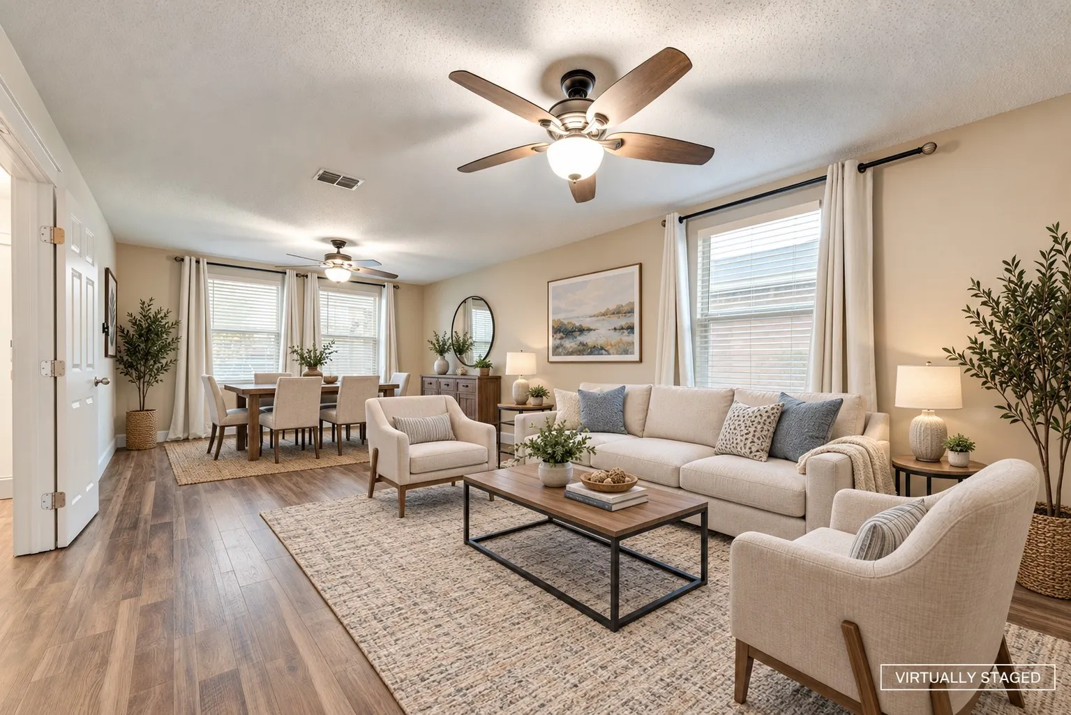 Living and dining combo at front of house - virtually staged